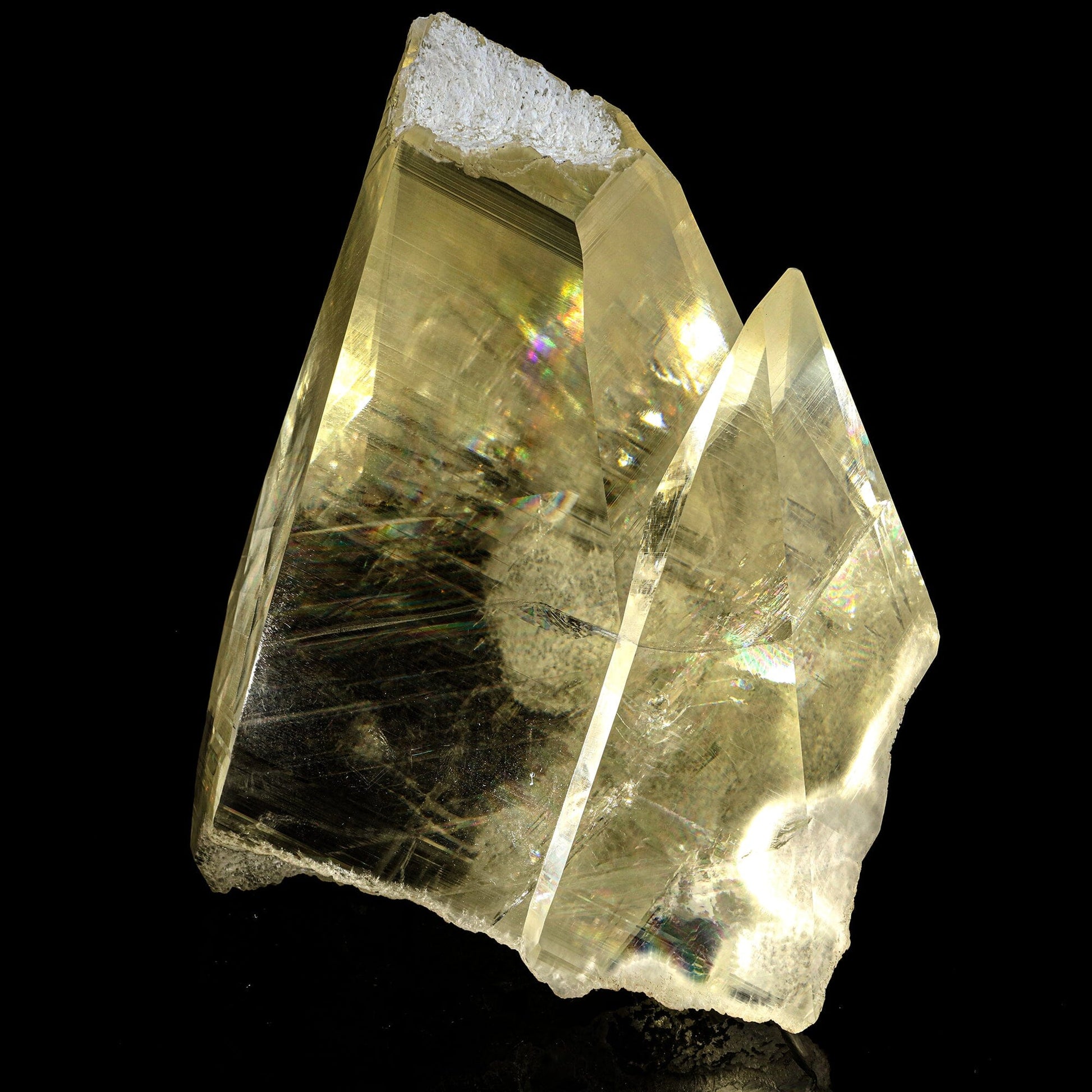 Calcite with champagne color, supreme clarity, and rainbows from light refraction. Museum quality natural specimen discovered near Jalgaon, accidentally, in a well pocket being drilled on farmland.