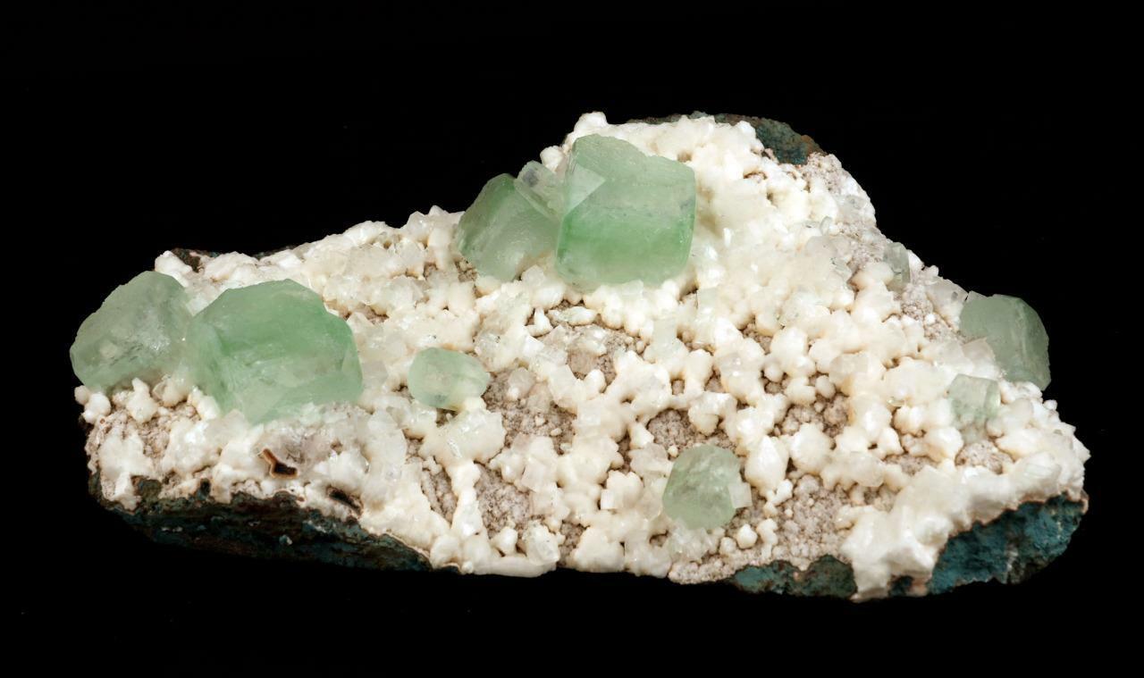 Light Green Apophyllite Cube on Heulandite Natural Minerals Specimen #…  https://www.superbminerals.us/products/light-green-apophyllite-cube-on-heulandite-natural-minerals-specimen-b-2120  Features: A huge cabinet-size specimen featuring several lustrous, clear, mint-green pseudocubic Apophyllite crystals with modified edges, as well as smaller, colourless, almost transparent Stilbite crystals, all on a bed of white tiny Huelandite crystals on a dark grey Matrix. The Apophyllite's