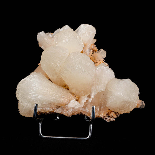 lustrous Terminated Stilbite Natural Mineral Specimen # B 4989  https://www.superbminerals.us/products/lustterorus-terminated-stilbite-natural-mineral-specimen-b-4989  Features:&nbsp;Featuring many excellent quality bladed groups of Stilbite in a soft white hue, resting over pearly stalactitic formations of peach colored Heulandite, this piece is a stunning example of the material. The sculpture is really flashy and three-dimensional, and I particularly like how the Stilbites