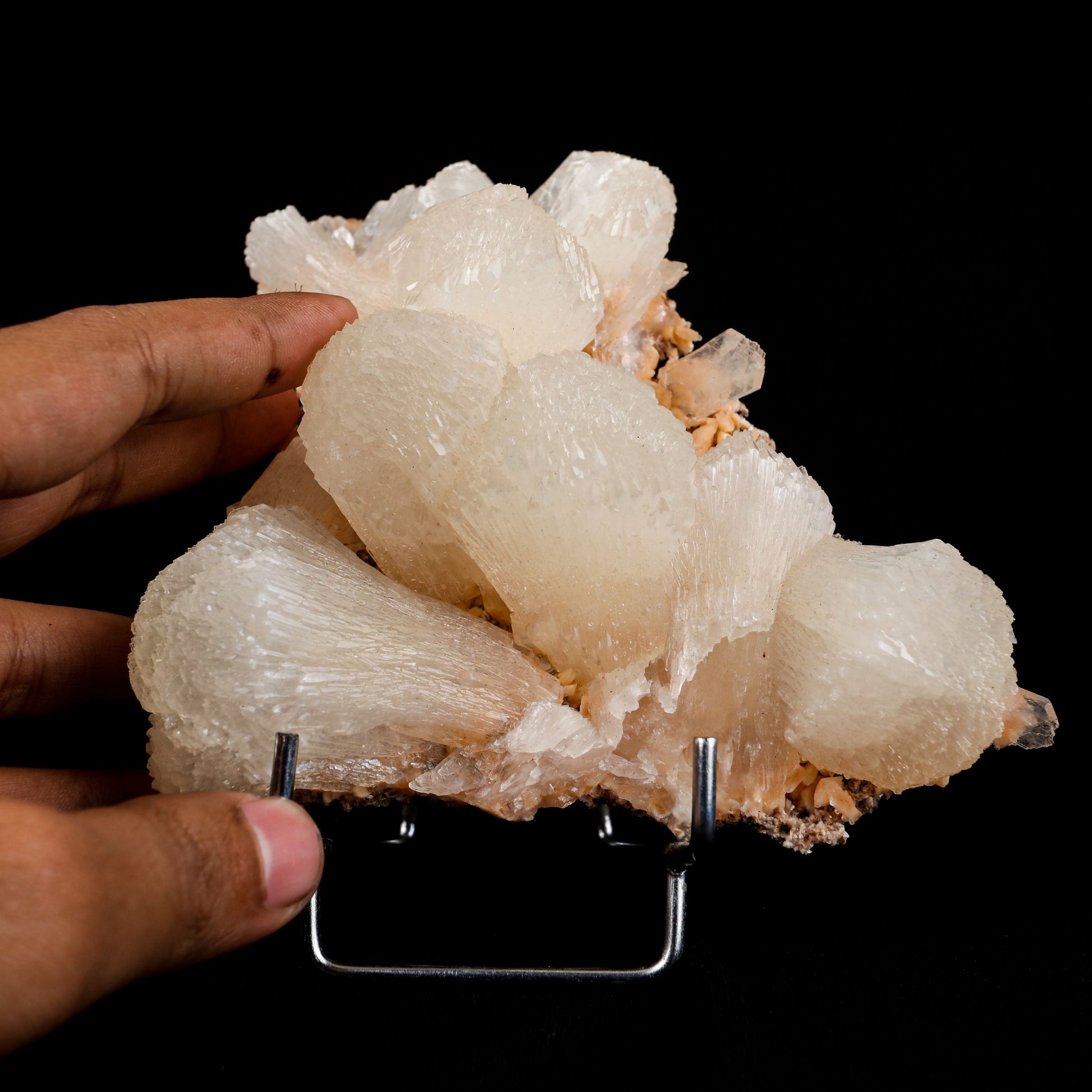 lustrous Terminated Stilbite Natural Mineral Specimen # B 4989  https://www.superbminerals.us/products/lustterorus-terminated-stilbite-natural-mineral-specimen-b-4989  Features:&nbsp;Featuring many excellent quality bladed groups of Stilbite in a soft white hue, resting over pearly stalactitic formations of peach colored Heulandite, this piece is a stunning example of the material. The sculpture is really flashy and three-dimensional, and I particularly like how the Stilbites