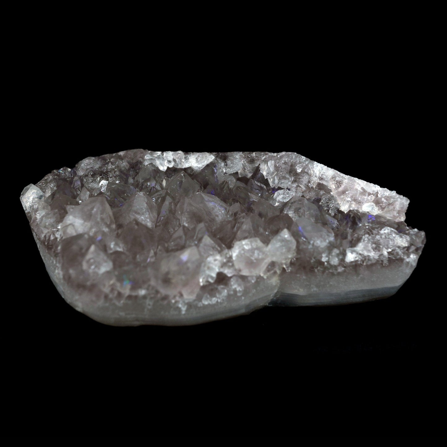 MM Quartz with Rainbow Effect 'Anandalite' Natural Mineral Specimen #…  https://www.superbminerals.us/products/mm-quartz-with-rainbow-effect-anandalite-natural-mineral-specimen-b-4794  Features: Anandalite is also known as Aurora Quartz or Rainbow Quartz, and is mined in India. The tiny little points of the clusters reflect luminescent rainbows that originate on the surface of the quartz (as opposed to the internal rainbows that reflect from within in other mineral specimens.) 