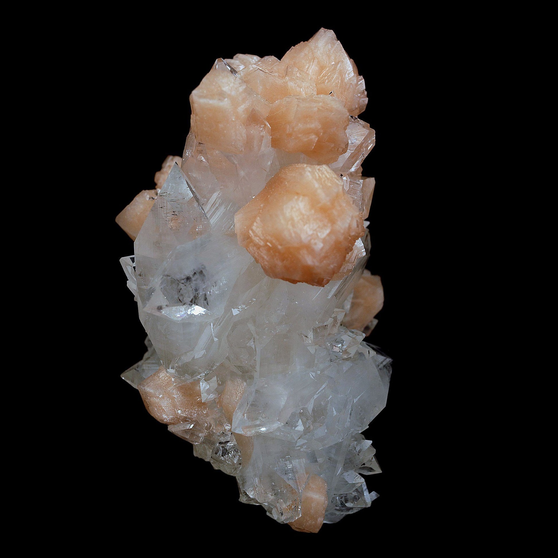 Peach Stilbite on Sprakling Apophyllite Crystals Natural Mineral Speci…  https://www.superbminerals.us/products/peach-stilbite-on-sprakling-apophyllite-crystals-natural-mineral-specimen-b-4054  Features:Classic combination specimen from the basalt trap rock quarries of India featuring a Fluorapophyllite crystal cluster with a Stilbite bowtie! While common in general, this is really a special piece - more beautiful and sparkly than most. The Fluorapophyllite is glassy, transparent to translucent
