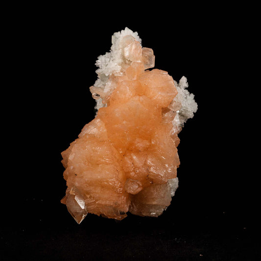 Pink Stilbite Cluster on Chalcedony Natural Mineral Specimen # B 5181  https://www.superbminerals.us/products/pink-stilbite-cluster-on-chalcedony-natural-mineral-specimen-b-5181  Features: Transparent green apophyllite crystals long with lustrous crystal faces and steep pyramidal terminations on matrix coated with lustrous peach-baggie coloured Stilbite crystals of varying sizes. Primary Mineral(s): Stilbite Secondary Mineral(s): N/AMatrix: Chalcedony 5 Inch x 3 InchWeight : 298 