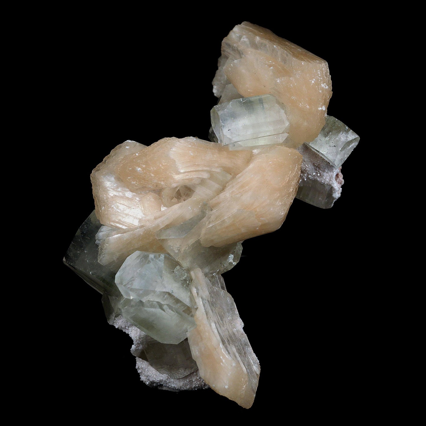 Pink Stilbite with Apophyllite Natural Mineral Specimen # B 4597  https://www.superbminerals.us/products/pink-stilbite-with-apophyllite-natural-mineral-specimen-b-4597  Features:A classic show specimen with crisp, gemmy to colourless Apophyllite crystals on matrix and peach tinted Stilbite. Overall, the work is in good condition, and its displayability is unquestionably above average. However, you cannot dispute that they are vibrant, appealing, and extremely visible.