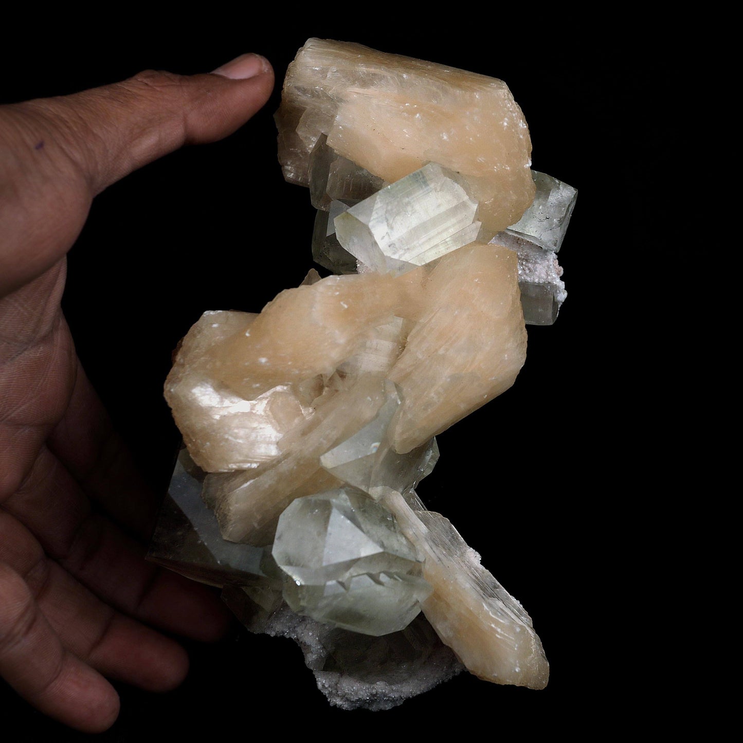 Pink Stilbite with Apophyllite Natural Mineral Specimen # B 4597  https://www.superbminerals.us/products/pink-stilbite-with-apophyllite-natural-mineral-specimen-b-4597  Features:A classic show specimen with crisp, gemmy to colourless Apophyllite crystals on matrix and peach tinted Stilbite. Overall, the work is in good condition, and its displayability is unquestionably above average. However, you cannot dispute that they are vibrant, appealing, and extremely visible.