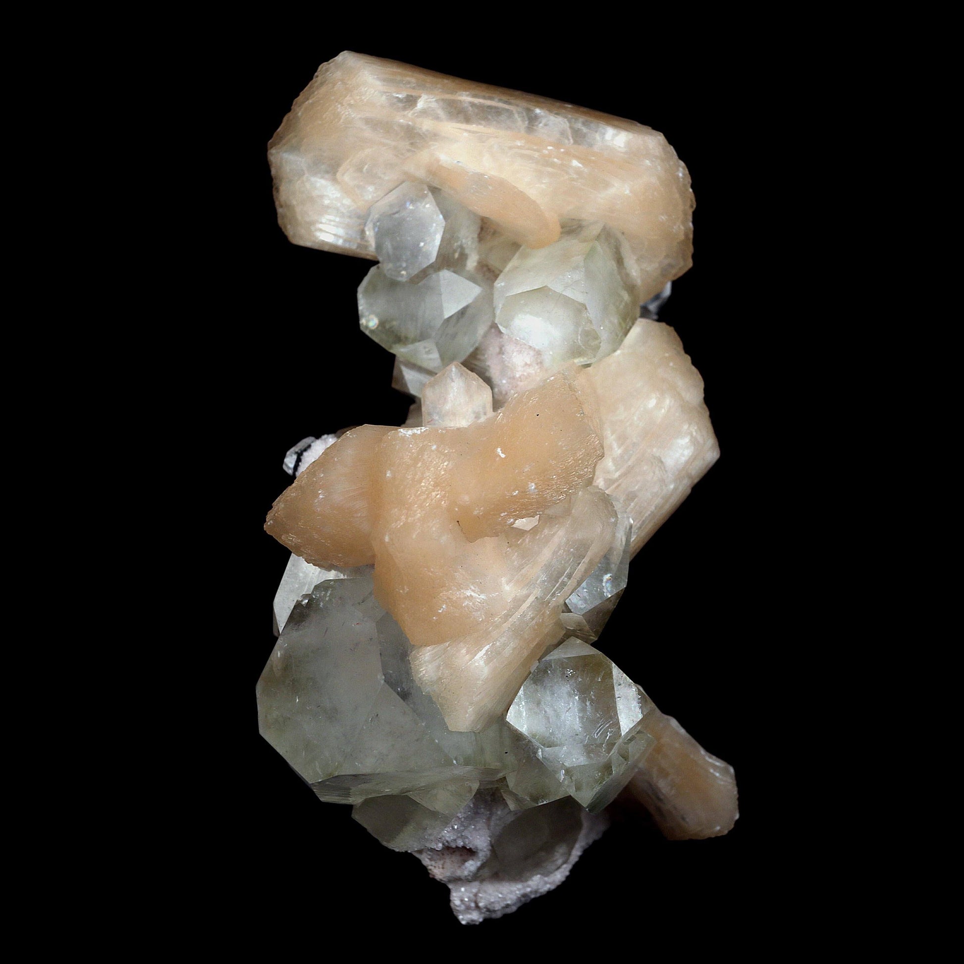 Pink Stilbite with Apophyllite Natural Mineral Specimen # B 4597  https://www.superbminerals.us/products/pink-stilbite-with-apophyllite-natural-mineral-specimen-b-4597  Features:A classic show specimen with crisp, gemmy to colourless Apophyllite crystals on matrix and peach tinted Stilbite. Overall, the work is in good condition, and its displayability is unquestionably above average. However, you cannot dispute that they are vibrant, appealing, and extremely visible.