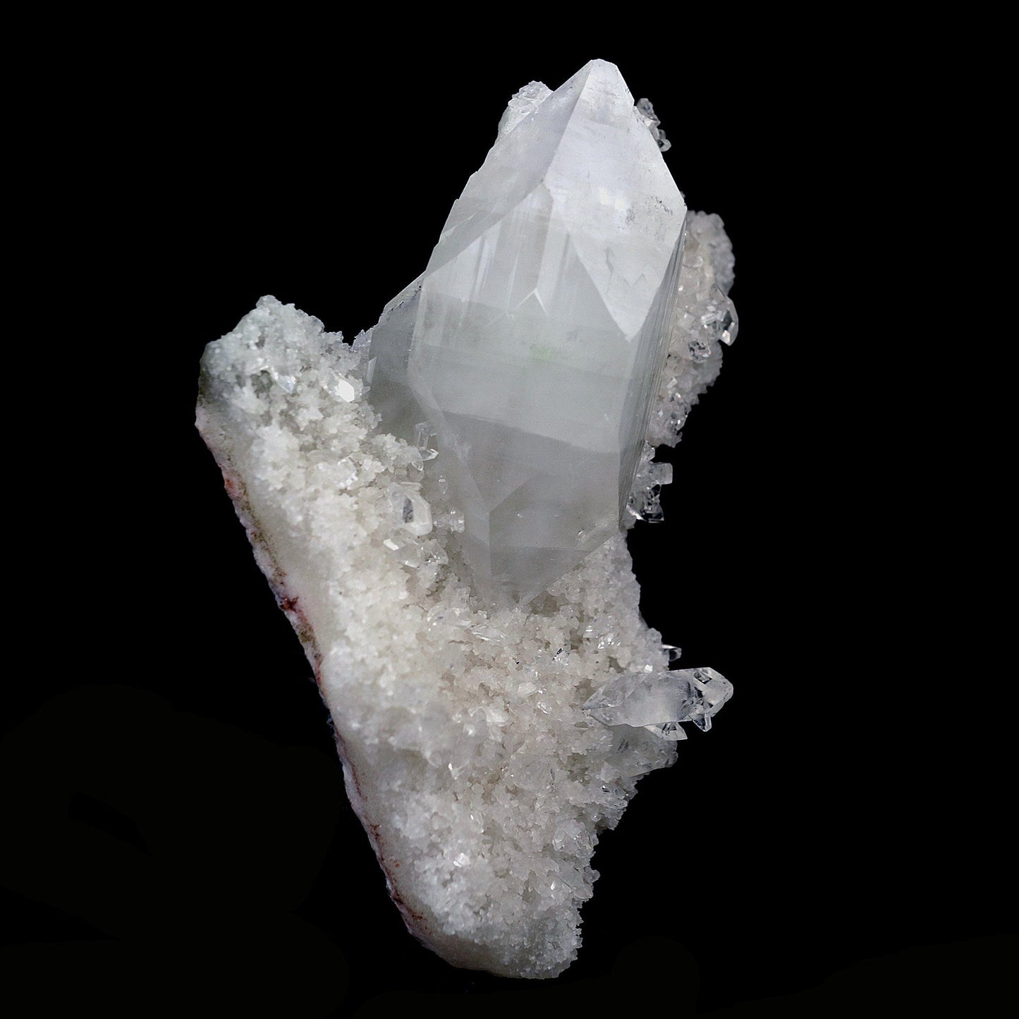 Pointed Apophyllite Crystal on Chalcedony Natural Mineral Specimen # B…  https://www.superbminerals.us/products/pointed-apophyllite-crystal-on-chalcedony-natural-mineral-specimen-b-4120  Features:One big intersecting doubly-terminated crystal of colorless Apophyllite perched on small plate of white chalcedony Microcrystals. The tip of the smaller crystal is cleaved with a clean surface. Primary Mineral(s): ApophylliteSecondary Mineral(s): StilbiteMatrix: N/A10 cm x 6 cm 150 GmsLocality: Jalgaon
