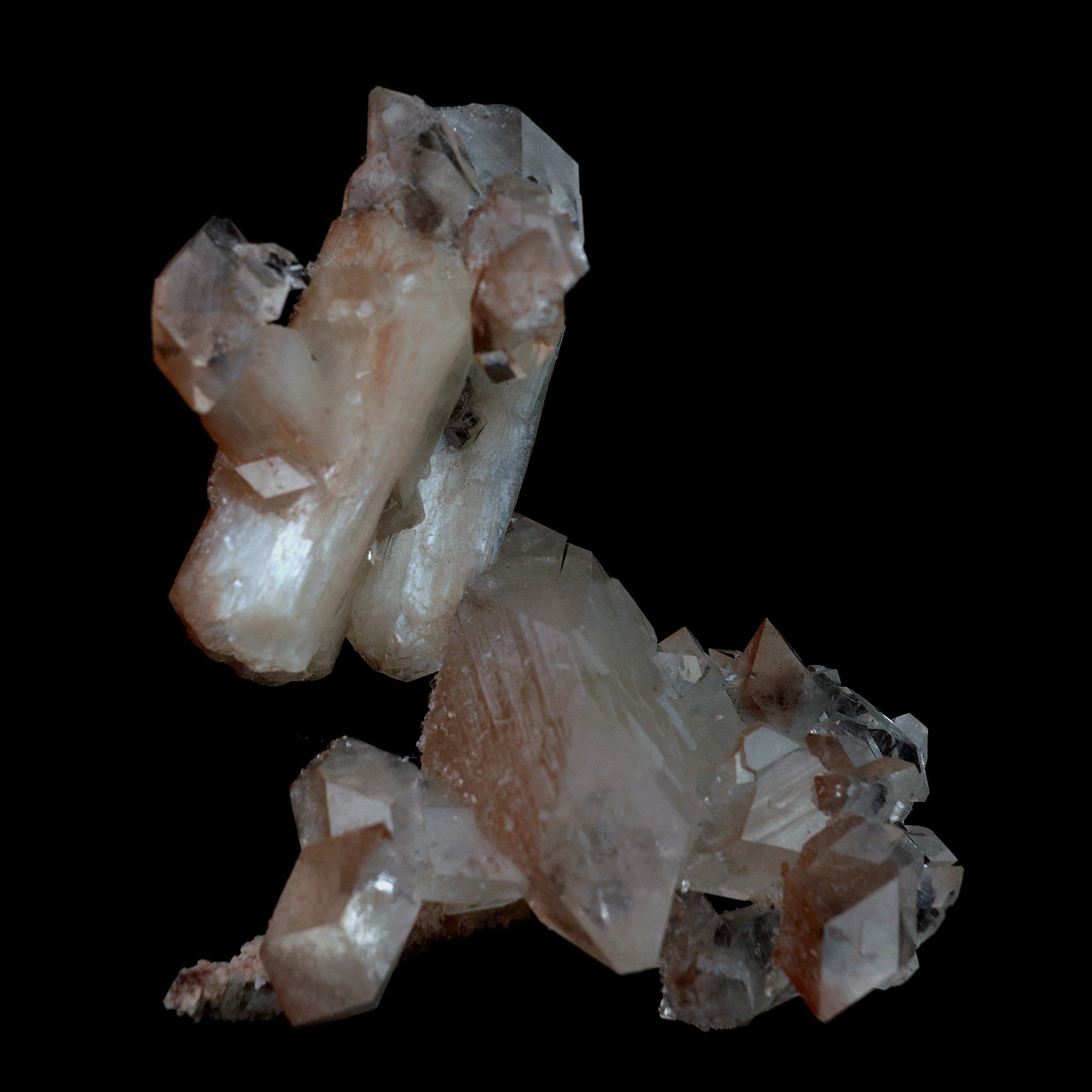 Pointed Apophyllite with Stilbite On Chalcedony Natural Mineral # B 41…  https://www.superbminerals.us/products/pointed-apophyllite-with-stilbite-on-chalcedony-natural-mineral-b-4176  Features:This specimen is mainly composed of the white/clear Apophyllite with inclusions of red hematite which transform partially red crystal and accented with the beautiful peachy colored stilbite that grew along with it. That being said, it was pieced back together seamlessly and is an extraordinary specimen