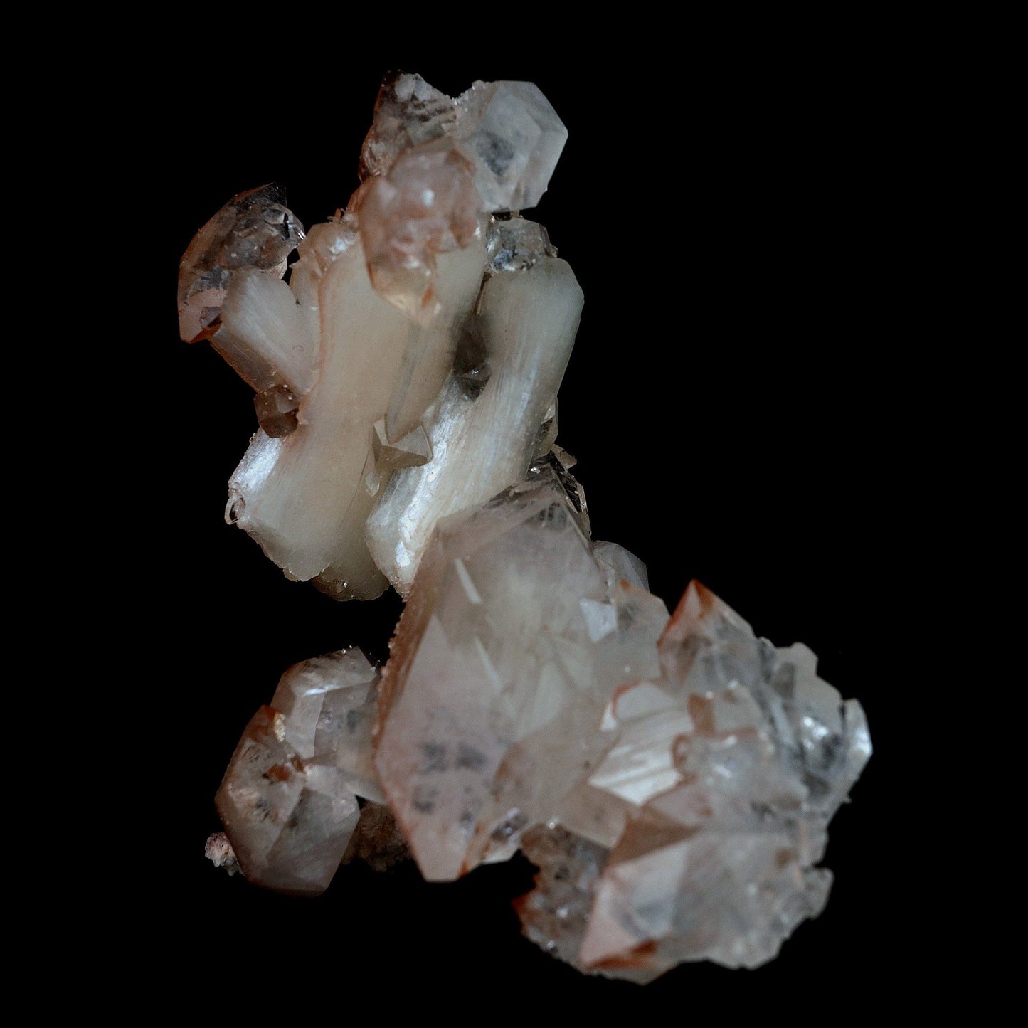 Pointed Apophyllite with Stilbite On Chalcedony Natural Mineral # B 41…  https://www.superbminerals.us/products/pointed-apophyllite-with-stilbite-on-chalcedony-natural-mineral-b-4176  Features:This specimen is mainly composed of the white/clear Apophyllite with inclusions of red hematite which transform partially red crystal and accented with the beautiful peachy colored stilbite that grew along with it. That being said, it was pieced back together seamlessly and is an extraordinary specimen