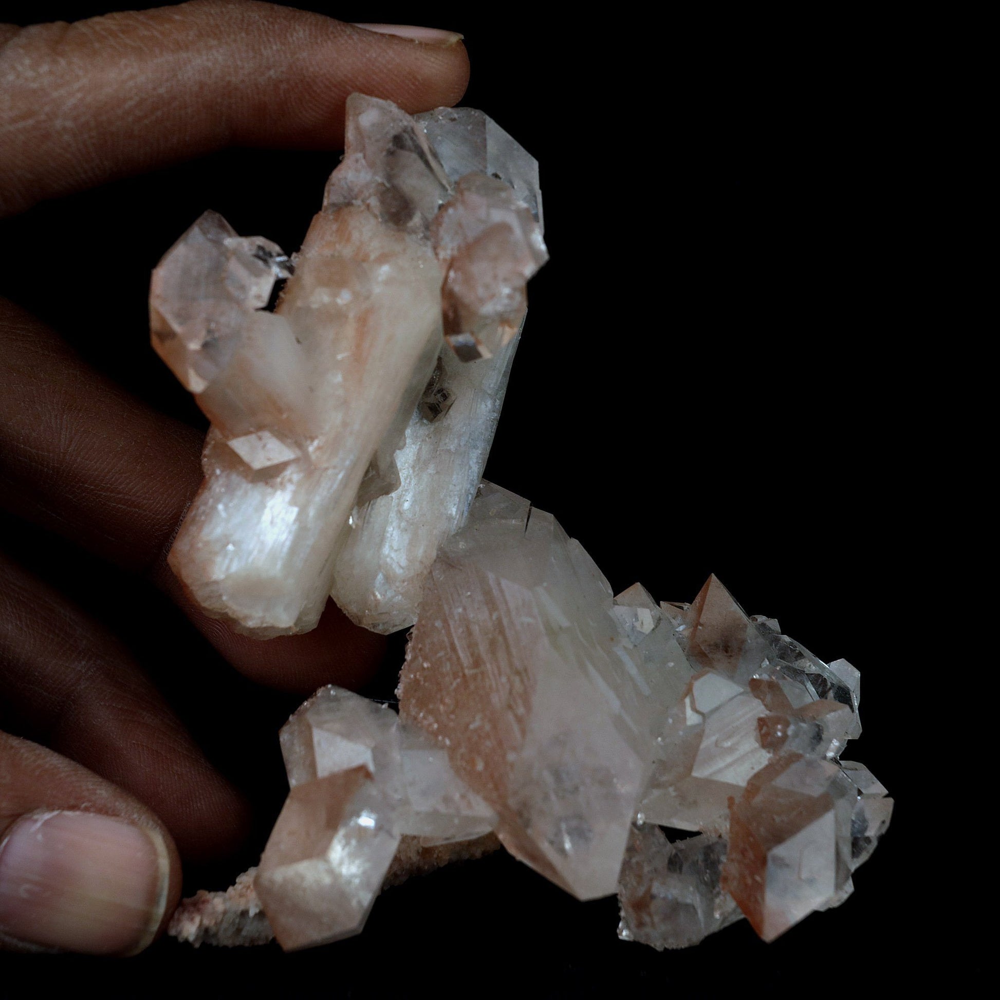 Pointed Apophyllite with Stilbite On Chalcedony Natural Mineral # B 41…  https://www.superbminerals.us/products/pointed-apophyllite-with-stilbite-on-chalcedony-natural-mineral-b-4176  Features:This specimen is mainly composed of the white/clear Apophyllite with inclusions of red hematite which transform partially red crystal and accented with the beautiful peachy colored stilbite that grew along with it. That being said, it was pieced back together seamlessly and is an extraordinary specimen