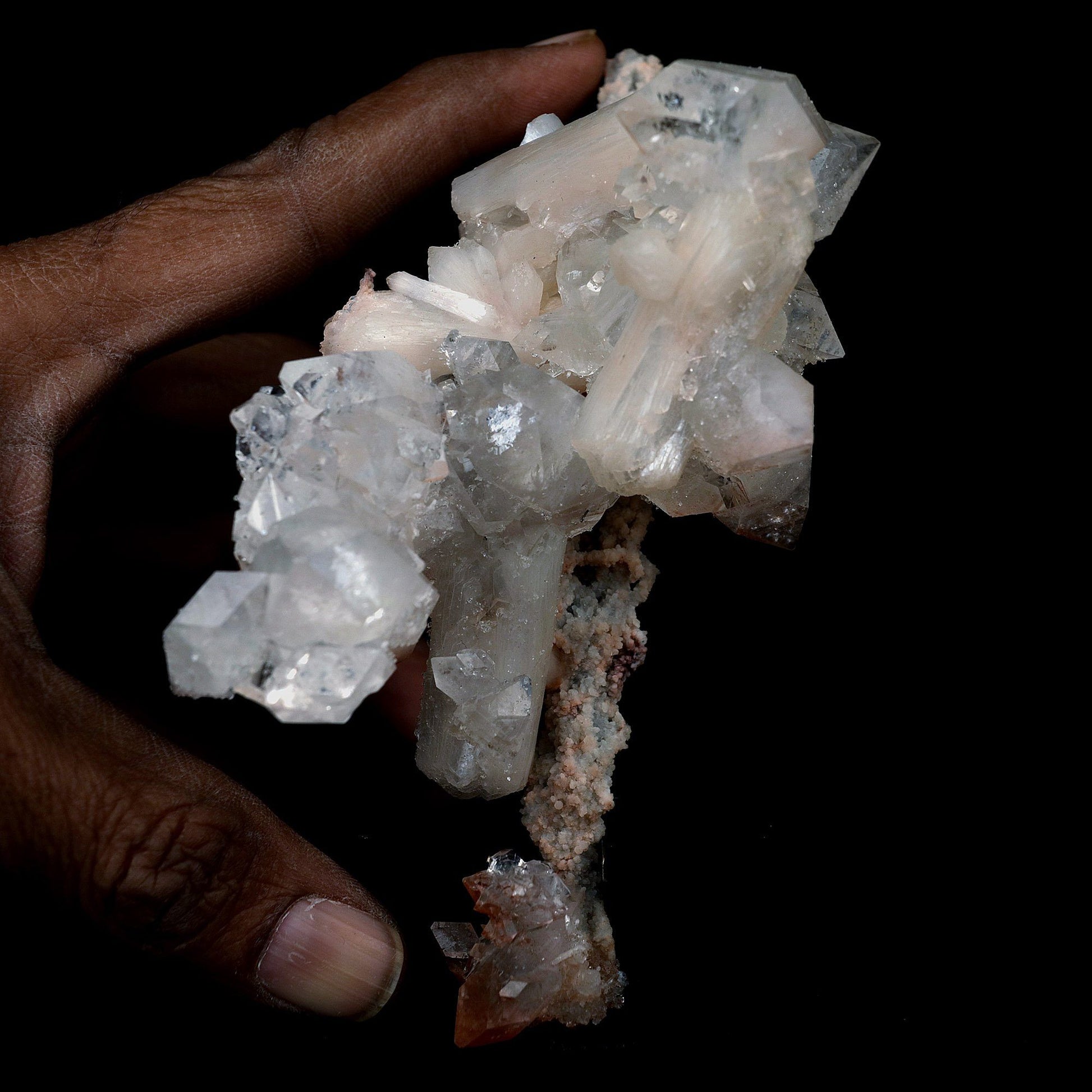 Pointed Apophyllite with Stilbite On Chalcedony Stalactite # B 4179  https://www.superbminerals.us/products/pointed-apophyllite-with-stilbite-on-chalcedony-stalactite-b-4179  Features:Very fine classic Apophyllite specimen with Stilbite on Quartz from the Jalgaon area Deccan Trap flood Basalts. Sharply formed crystals of Apophyllite, displaying strong development of prism and pyramidal faces. Crystals of Apophyllite have pleasing color less gemmy pyramidal areas due to hematite inclusions 