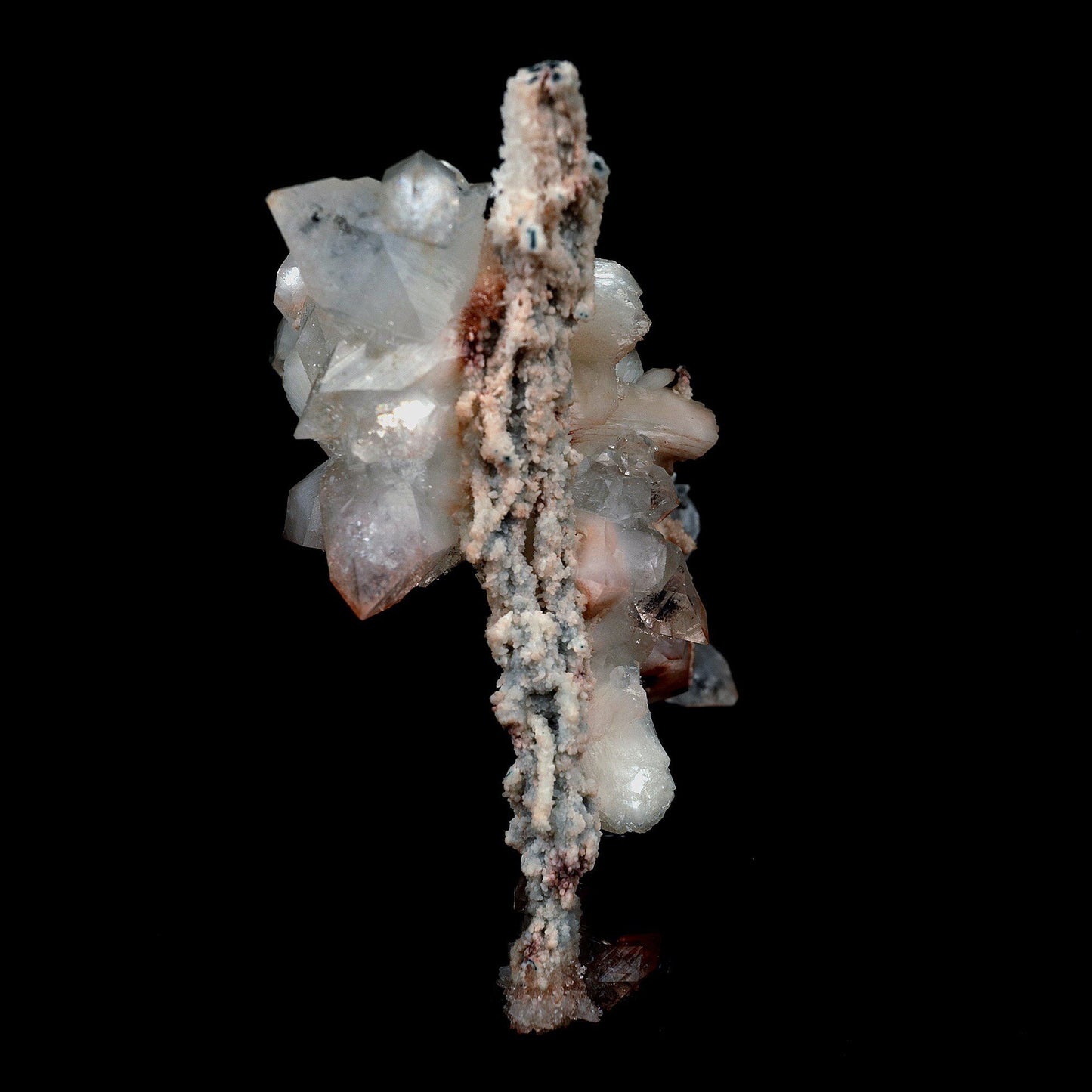 Pointed Apophyllite with Stilbite On Chalcedony Stalactite # B 4179  https://www.superbminerals.us/products/pointed-apophyllite-with-stilbite-on-chalcedony-stalactite-b-4179  Features:Very fine classic Apophyllite specimen with Stilbite on Quartz from the Jalgaon area Deccan Trap flood Basalts. Sharply formed crystals of Apophyllite, displaying strong development of prism and pyramidal faces. Crystals of Apophyllite have pleasing color less gemmy pyramidal areas due to hematite inclusions 