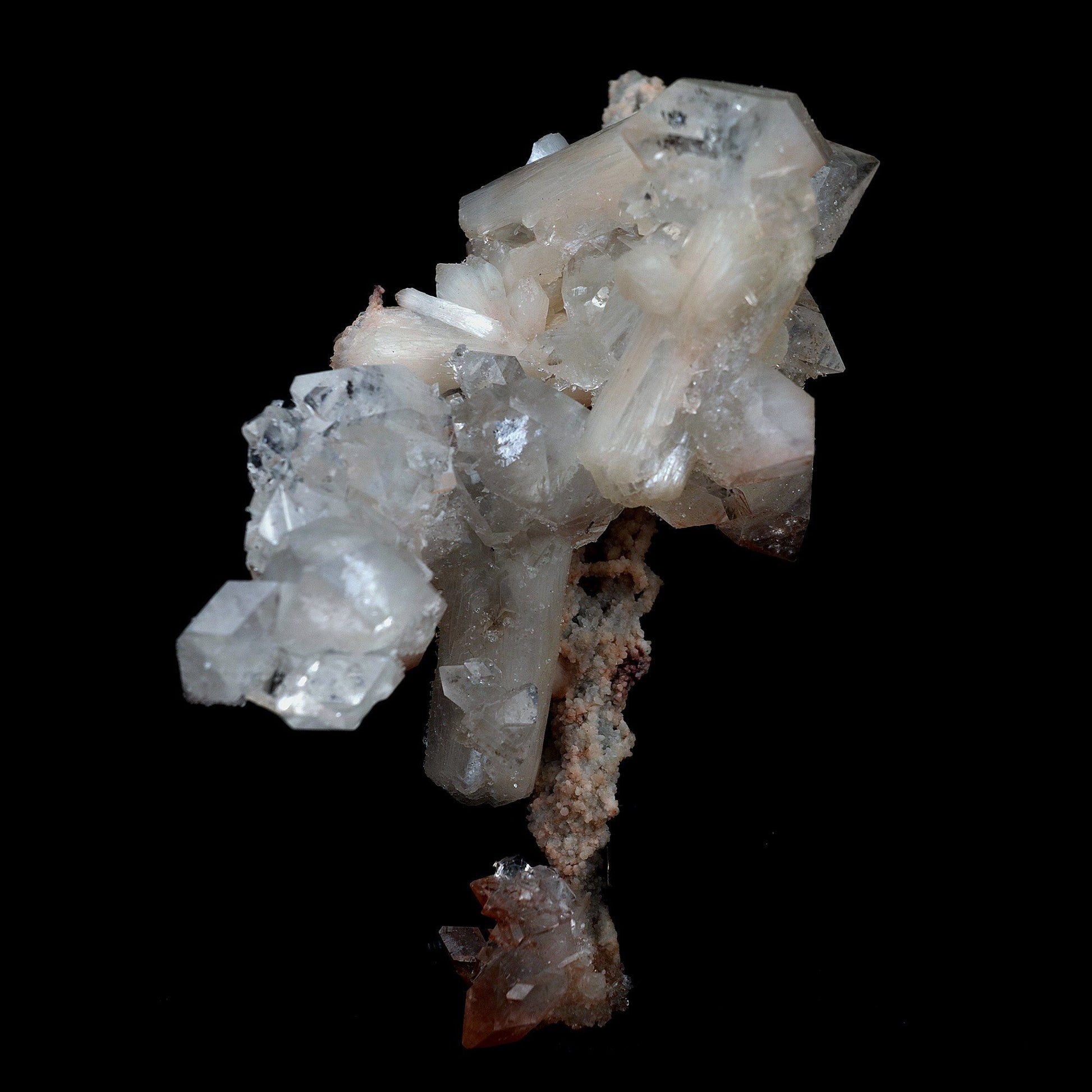 Pointed Apophyllite with Stilbite On Chalcedony Stalactite # B 4179  https://www.superbminerals.us/products/pointed-apophyllite-with-stilbite-on-chalcedony-stalactite-b-4179  Features:Very fine classic Apophyllite specimen with Stilbite on Quartz from the Jalgaon area Deccan Trap flood Basalts. Sharply formed crystals of Apophyllite, displaying strong development of prism and pyramidal faces. Crystals of Apophyllite have pleasing color less gemmy pyramidal areas due to hematite inclusions 
