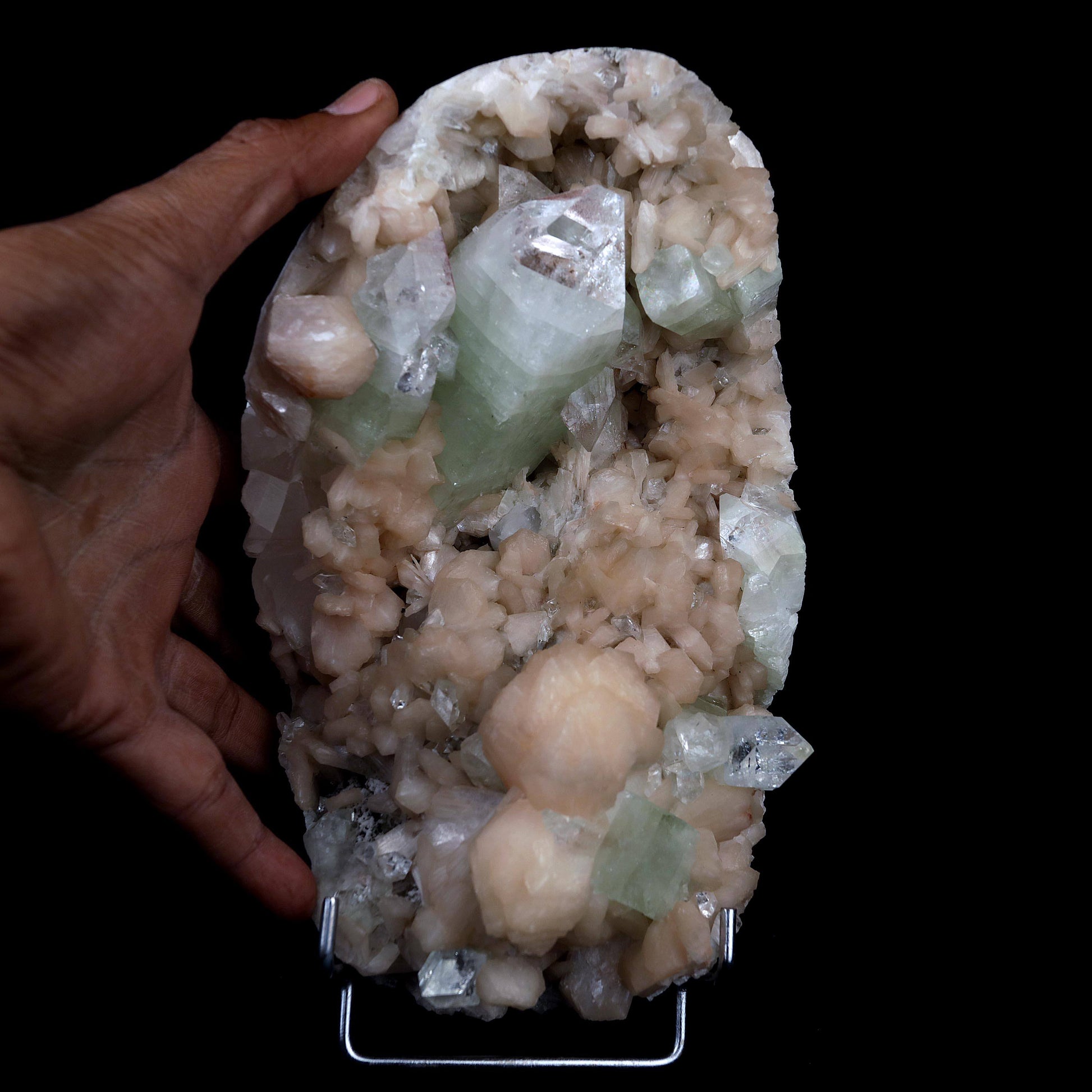 Pointed Green Apophyllite with Stilbite Inside Geode Natural Mineral S…  https://www.superbminerals.us/products/pointed-green-apophyllite-with-stilbite-inside-geode-natural-mineral-specimen-b-4385  Features:Beautiful gemmy and lustrous, bi-colored tetragonal pyramidal fluorapophyllite crystals are very aesthetically set amidst a dense lining of pearlescent flesh-pink stilbites on this dramatic rich pocket from recent finds at Jalgaon. The impressive large upright apophyllite.Primary Mineral(s): Apophyllite