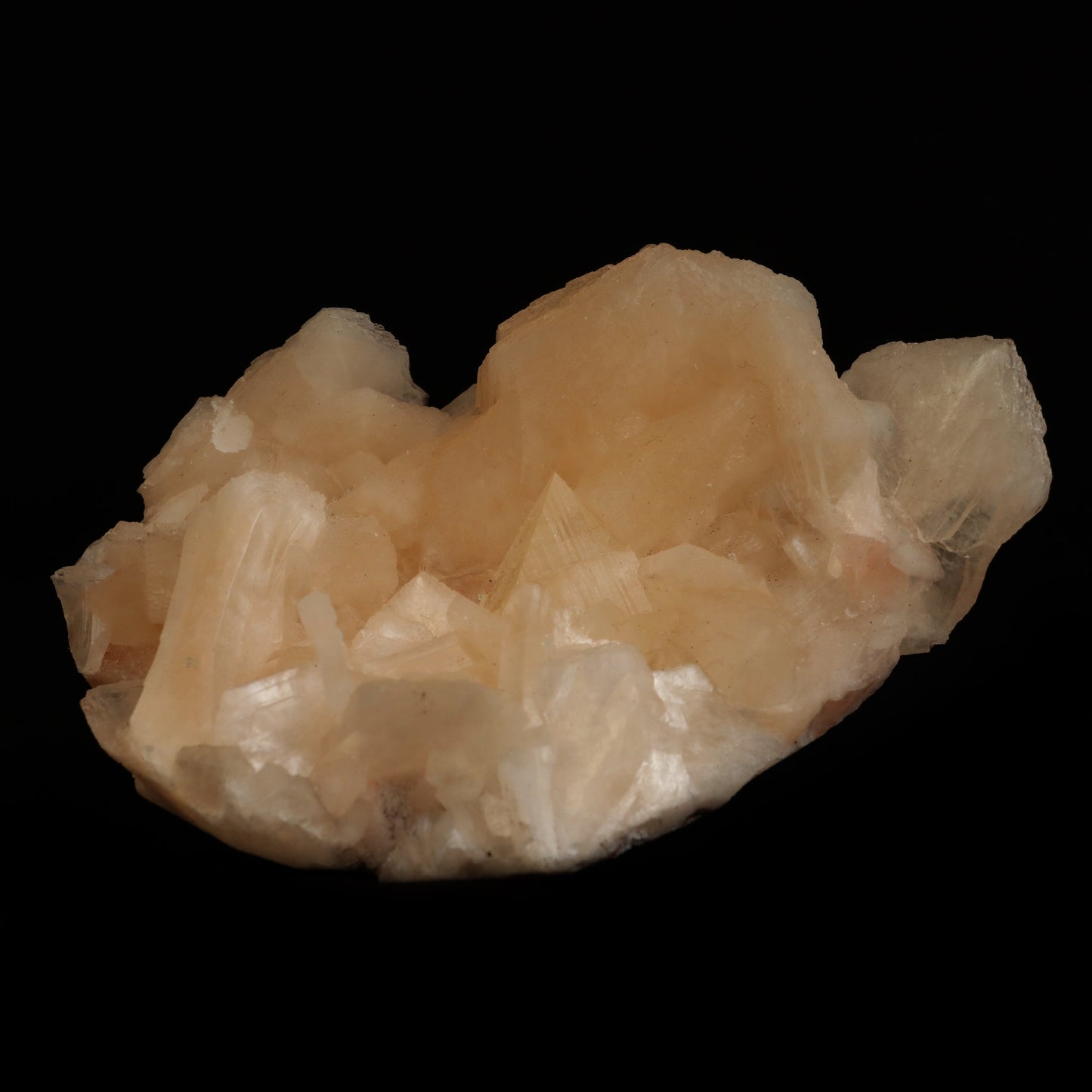Powellite (Flurocent Mineral) With Stilbite Natural Mineral Specimen …  https://www.superbminerals.us/products/powellite-flurocent-mineral-with-stilbite-natural-mineral-specimen-b-5034  Features:&nbsp;Powellite is one of the rarest and most valuable minerals found in India's famous Deccan Trap basalts. This pair of beautiful yellow-orange crystals is nestled between and on top of exceedingly shiny and iridescent white Stilbite blades.Powellites feature a dazzling, golden fluorescence, 