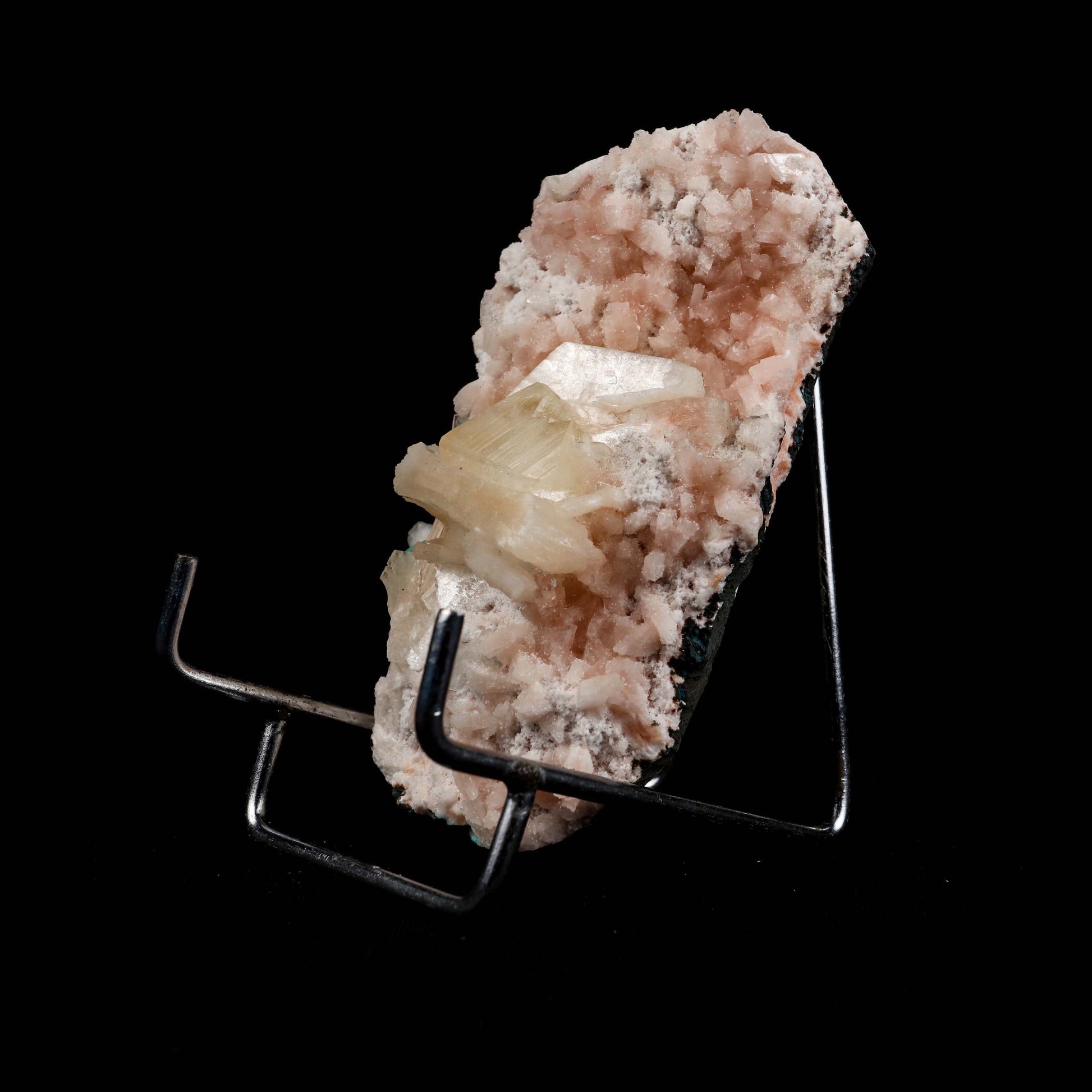 Powellite with Stilbite on Heulandite Natural Mineral Specimen # B 49…  https://www.superbminerals.us/products/powellite-with-stilbite-on-heulandite-natural-mineral-specimen-b-4997  Features: Lustrous powellite crystals in a nest of lustrous, ivory colored stilbite crystals. The powellite crystal fluoresces a bright yellow with stilbite. Very rare and unique specimen.Primary Mineral(s): PowelliteSecondary Mineral(s): StilbiteMatrix: Heulandite 4 Inch x 2 InchWeight : 205 GmsLocality: Nashik