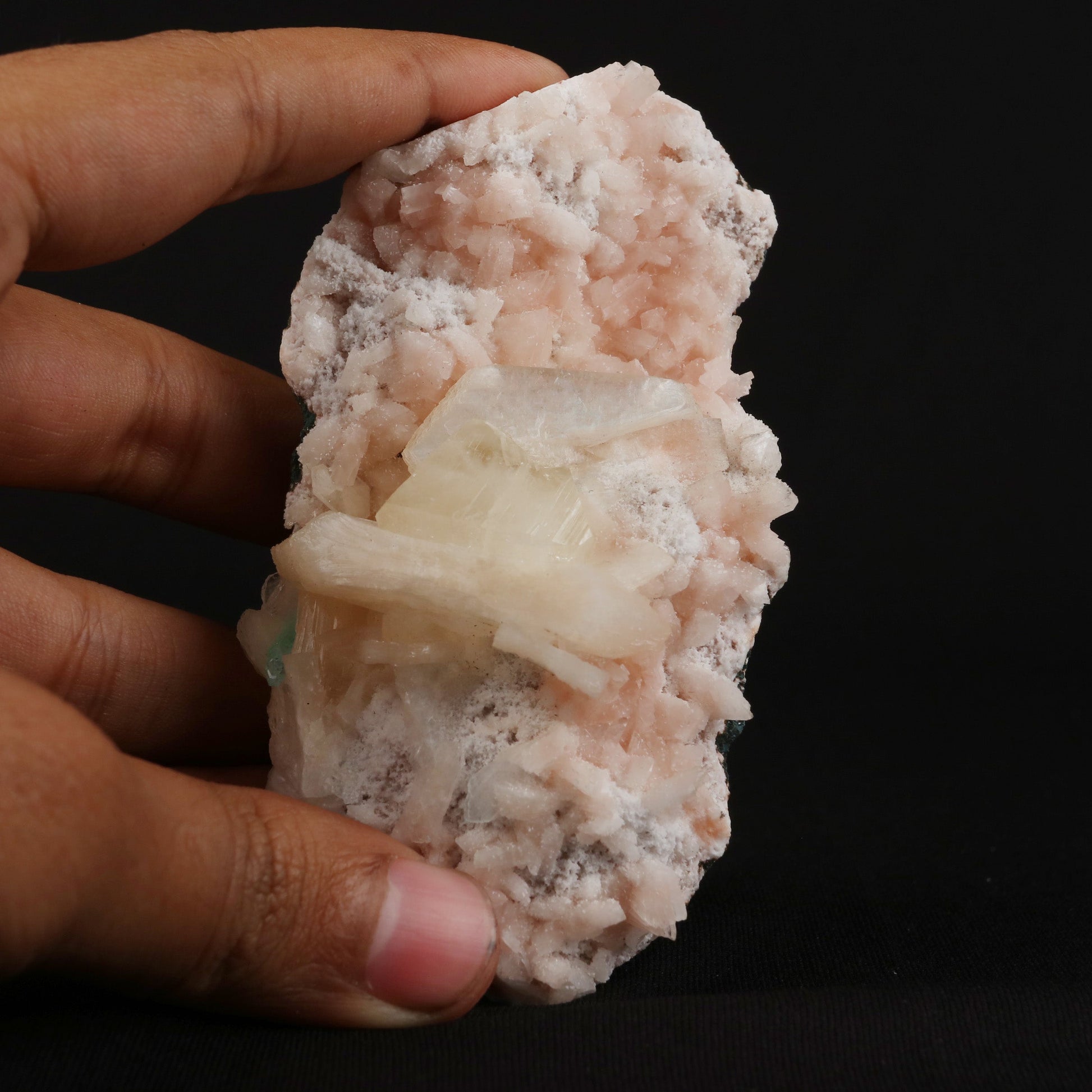 Powellite with Stilbite on Heulandite Natural Mineral Specimen # B 49…  https://www.superbminerals.us/products/powellite-with-stilbite-on-heulandite-natural-mineral-specimen-b-4997  Features: Lustrous powellite crystals in a nest of lustrous, ivory colored stilbite crystals. The powellite crystal fluoresces a bright yellow with stilbite. Very rare and unique specimen.Primary Mineral(s): PowelliteSecondary Mineral(s): StilbiteMatrix: Heulandite 4 Inch x 2 InchWeight : 205 GmsLocality: Nashik