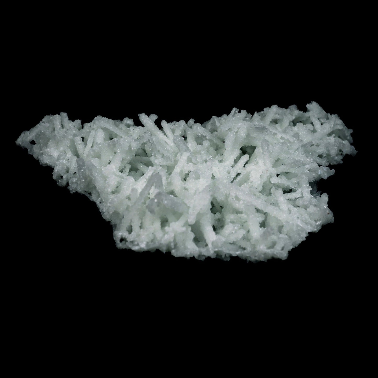 Prehnite Pseudomorphed Rare Find Natural Mineral Specimen # B 4714  https://www.superbminerals.us/products/prehnite-pseudomorphed-rare-find-natural-mineral-specimen-b-4714  Features: Pretty mint-green prehnite has pseudomorphed elongated laumontite crystals on this classic and excellent large jackstraw cluster from the famous Malad Quarry. The translucent pseudos and some of them are hollow on this impressive sculptural 360-degree specimen. Seldom on the market today