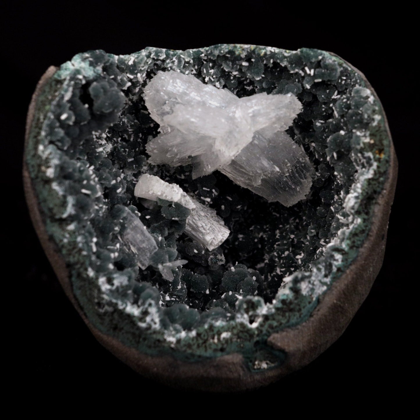 Rare Find Epi-Stilbite Inside Black Chalcedony Natural Mineral Specime…  https://www.superbminerals.us/products/rare-find-epi-stilbite-inside-black-chalcedony-natural-mineral-specimen-b-4736  Features: Beautiful, complete, radial aggregates of white Epistilbite on basalt matrix make this a one-of-a-kind find. The entire Epistilbite collection is unblemished, and the object shines out wonderfully in the collection. Although Epistilbite crystals found outside of India are often small, the greatest examples