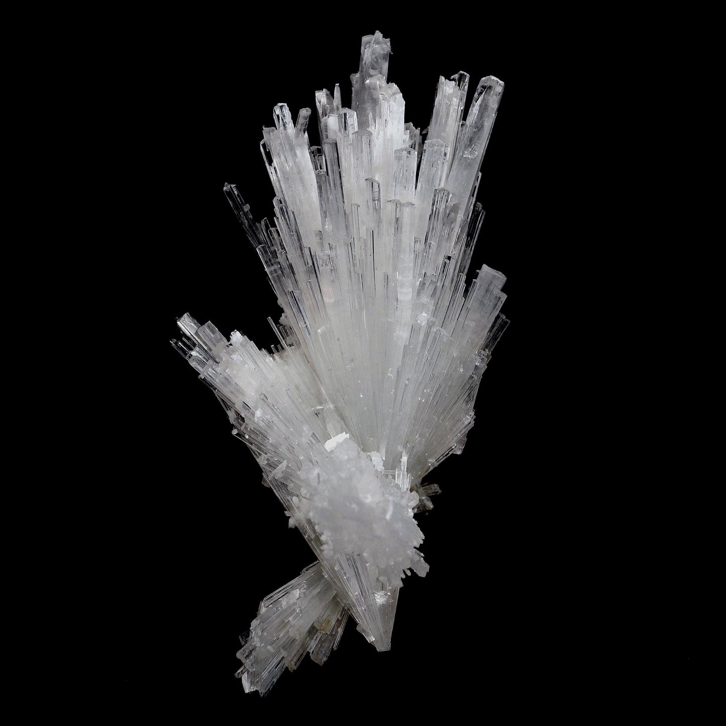 Scolecite Glassy Spray Natural Mineral Specimen # B 4608  https://www.superbminerals.us/products/scolecite-glassy-spray-natural-mineral-specimen-b-4608  Features: A large, tapered spray of elongated colorless Scolecite crystals. The Scolecite crystals are glassy and highly translucent with transparent terminations. A beautiful specimen in excellent condition.Primary Mineral(s): Scolecite