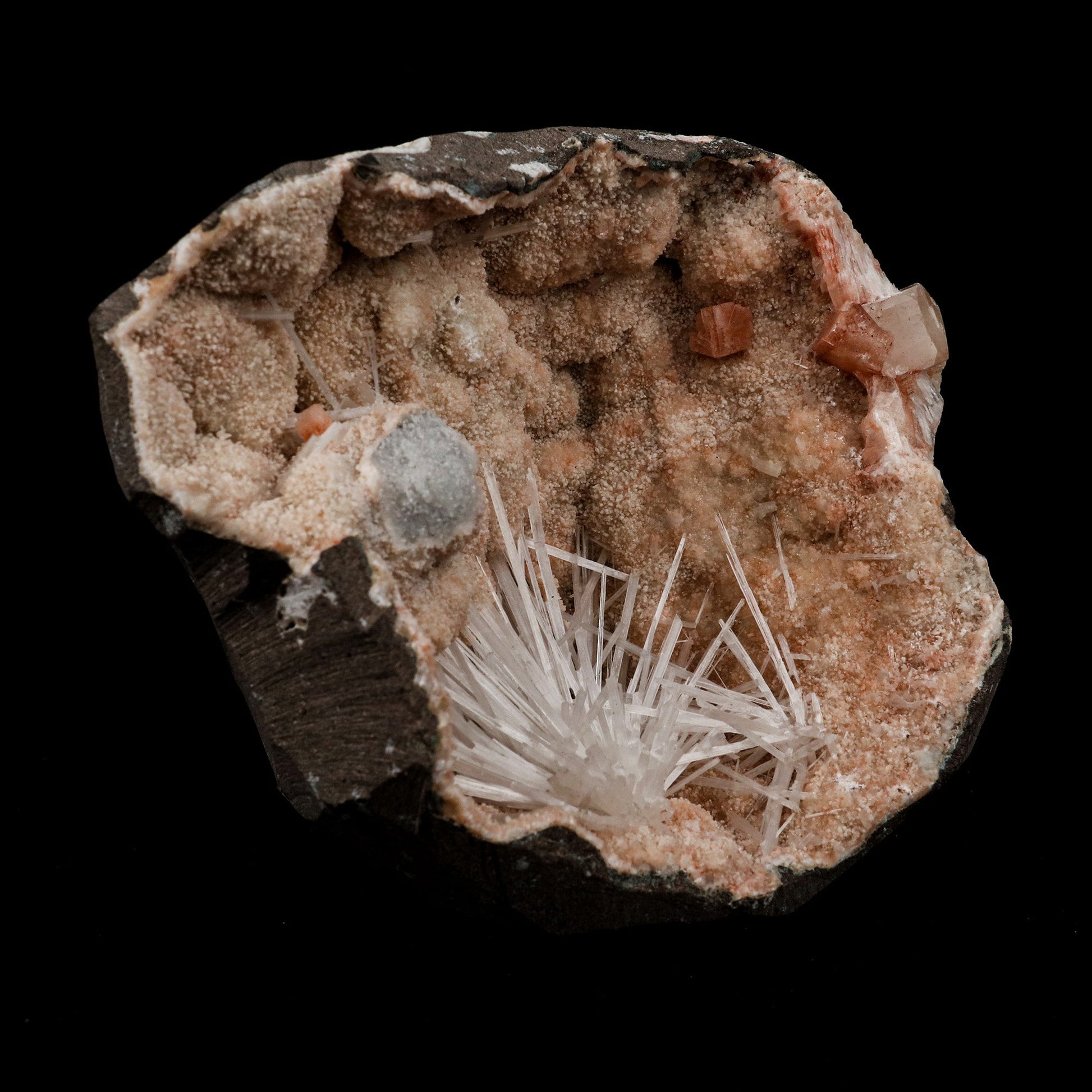 Scolecite Sprays Fan Inside Heulandite Geode Natural Mineral Specimen …  https://www.superbminerals.us/products/scolecite-sprays-fan-inside-heulandite-geode-natural-mineral-specimen-b-5133  Features: A large, free-standing Geode with peach-colored Heulandite crystals and two clusters of beige Stilbite crystals. The Geode is a three-dimensional entity that is tall, thin, and deep.Very nice and in excellent condition. Primary Mineral(s): Scolecite Secondary Mineral(s): N/AMatrix: Heulandite 