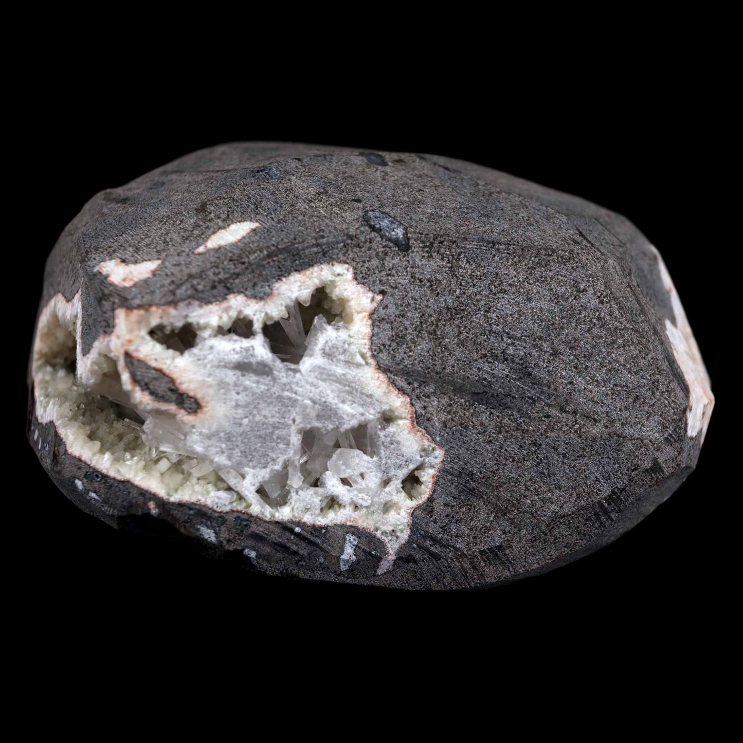 Scolecite Sprays Inside Geode Natural Mineral Specimen # B 4649  https://www.superbminerals.us/products/scolecite-sprays-inside-geode-natural-mineral-specimen-b-4649  Features: A lovely item with a geode lined with beige, glossy Heulandite crystals. The crystals have a pearly, almost glassy sheen and are highly defined.This item is glistening. Very good condition. Primary Mineral(s): ScoleciteSecondary Mineral(s): N/AMatrix: Heulandite12 cm x 6 cm Weight : 910 Gms Locality: Jalgaon