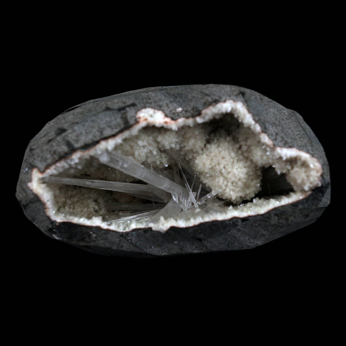 Scolecite Sprays Inside Geode Natural Mineral Specimen # B 4649  https://www.superbminerals.us/products/scolecite-sprays-inside-geode-natural-mineral-specimen-b-4649  Features: A lovely item with a geode lined with beige, glossy Heulandite crystals. The crystals have a pearly, almost glassy sheen and are highly defined.This item is glistening. Very good condition. Primary Mineral(s): ScoleciteSecondary Mineral(s): N/AMatrix: Heulandite12 cm x 6 cm Weight : 910 Gms Locality: Jalgaon
