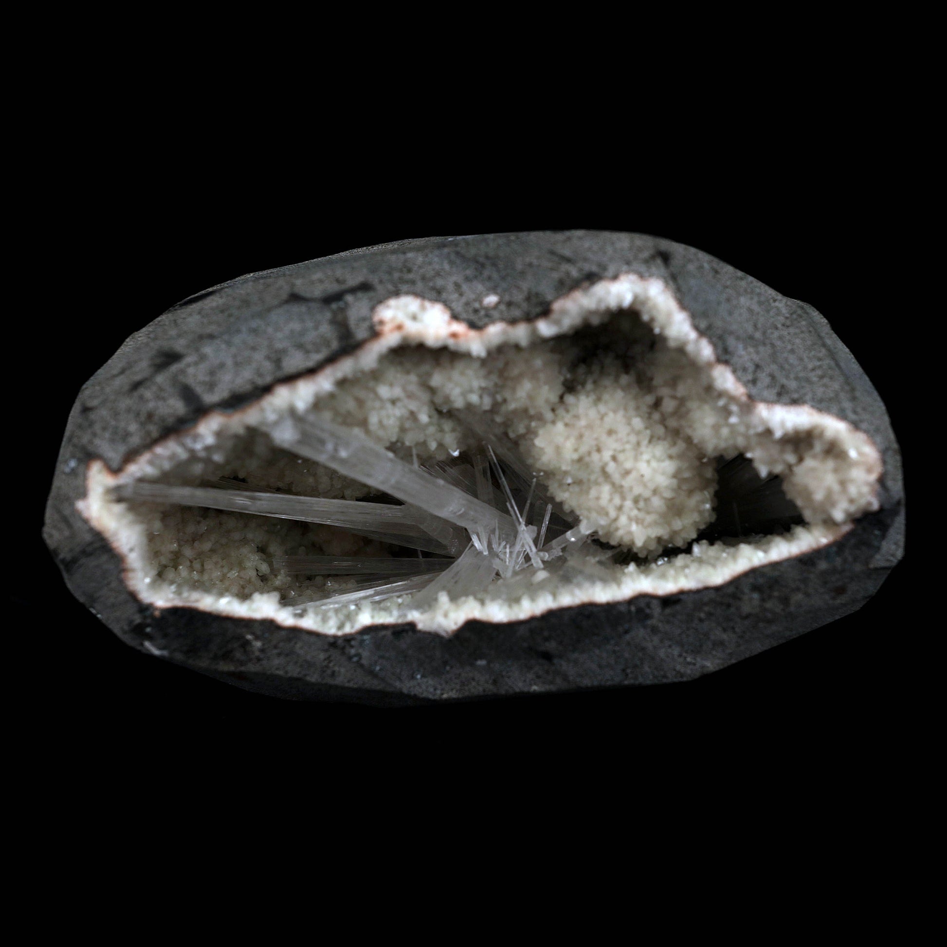 Scolecite Sprays Inside Geode Natural Mineral Specimen # B 4649  https://www.superbminerals.us/products/scolecite-sprays-inside-geode-natural-mineral-specimen-b-4649  Features: A lovely item with a geode lined with beige, glossy Heulandite crystals. The crystals have a pearly, almost glassy sheen and are highly defined.This item is glistening. Very good condition. Primary Mineral(s): ScoleciteSecondary Mineral(s): N/AMatrix: Heulandite12 cm x 6 cm Weight : 910 Gms Locality: Jalgaon