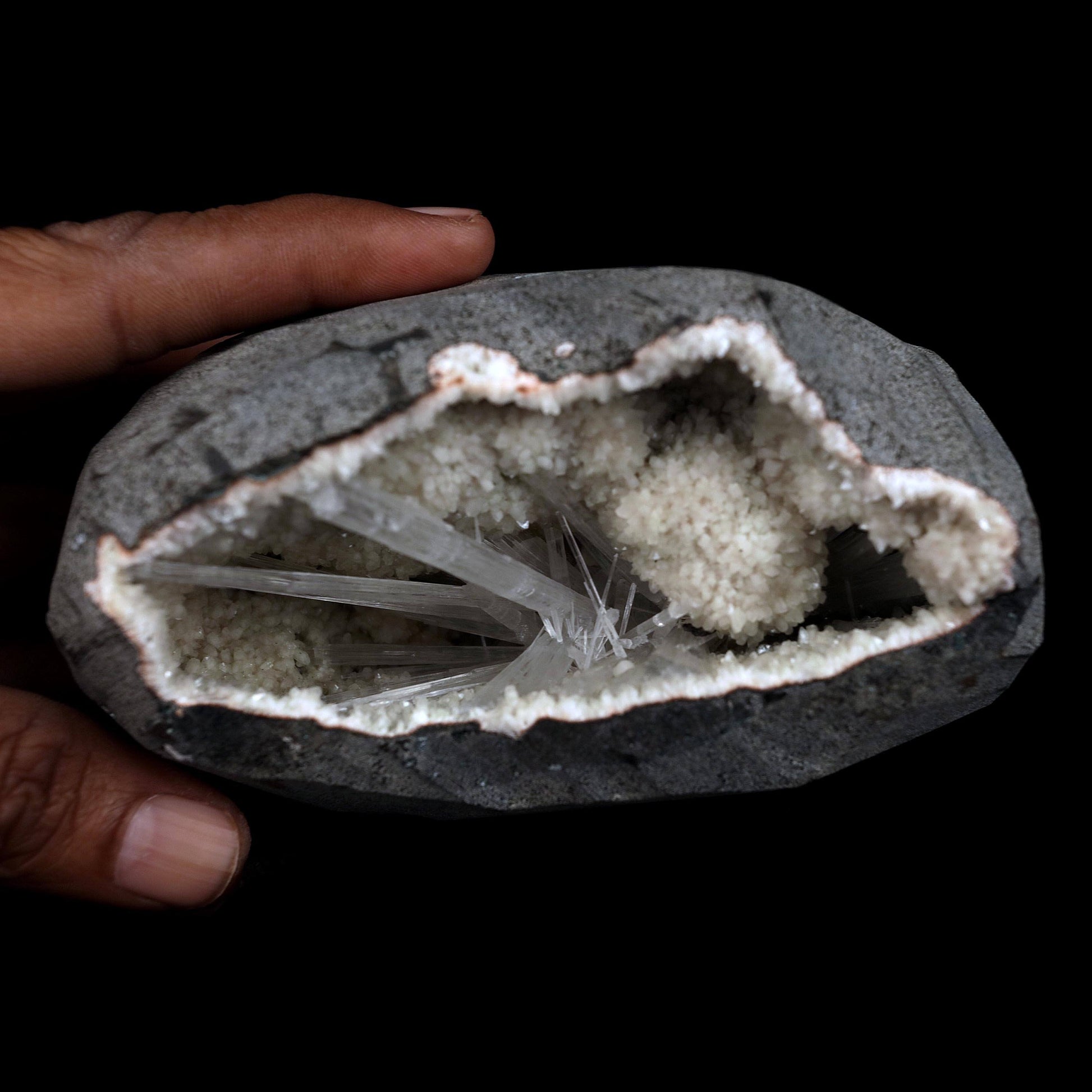 Scolecite Sprays Inside Geode Natural Mineral Specimen # B 4649  https://www.superbminerals.us/products/scolecite-sprays-inside-geode-natural-mineral-specimen-b-4649  Features: A lovely item with a geode lined with beige, glossy Heulandite crystals. The crystals have a pearly, almost glassy sheen and are highly defined.This item is glistening. Very good condition. Primary Mineral(s): ScoleciteSecondary Mineral(s): N/AMatrix: Heulandite12 cm x 6 cm Weight : 910 Gms Locality: Jalgaon