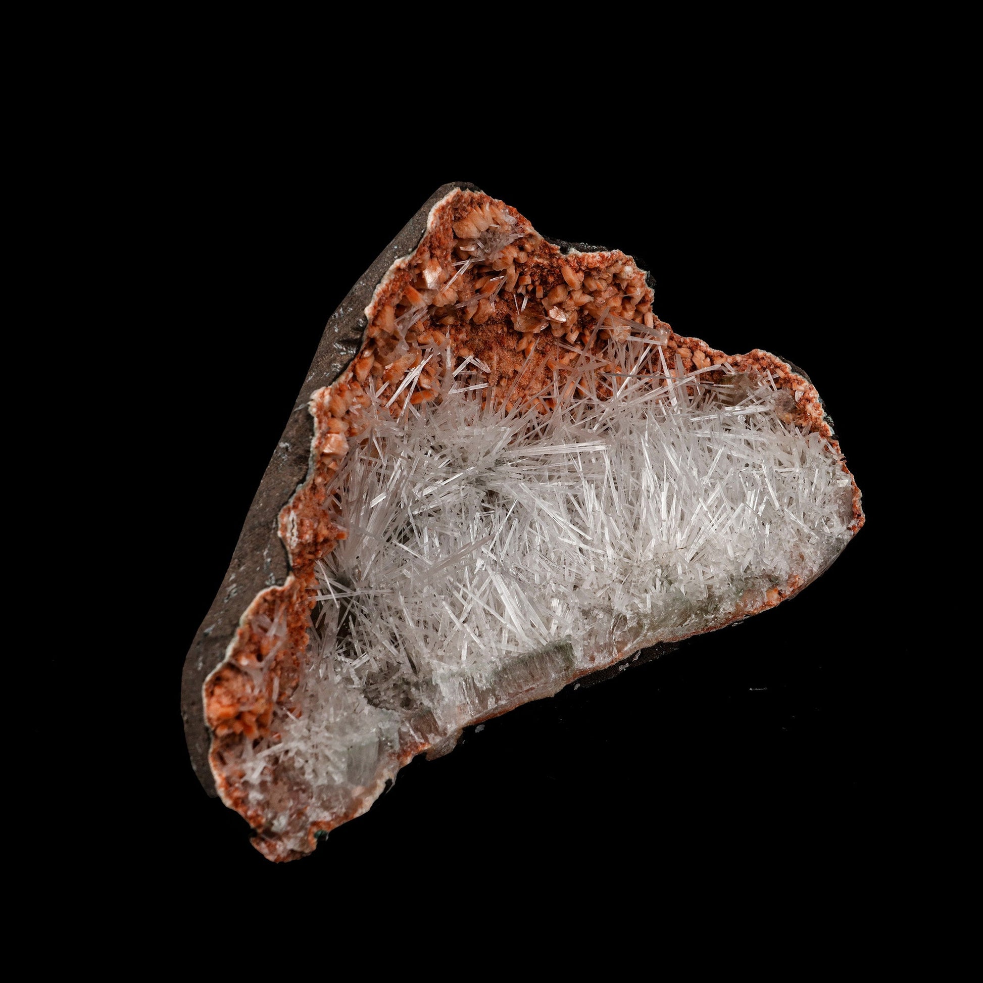 Scolecite Sprays Inside Heulandite Geode Natural Mineral Specimen # B…  https://www.superbminerals.us/products/scolecite-sprays-inside-heulandite-geode-natural-mineral-specimen-b-5276  Features: A beautiful display specimen from the Jalgaon Quarry in India consists of radial aggregates of white Scolecite aesthetically placed in a narrow crystal-lined vug. It was a bit of a challenge to photograph the piece, but in person, the piece is much better than the photos suggest.&nbsp;