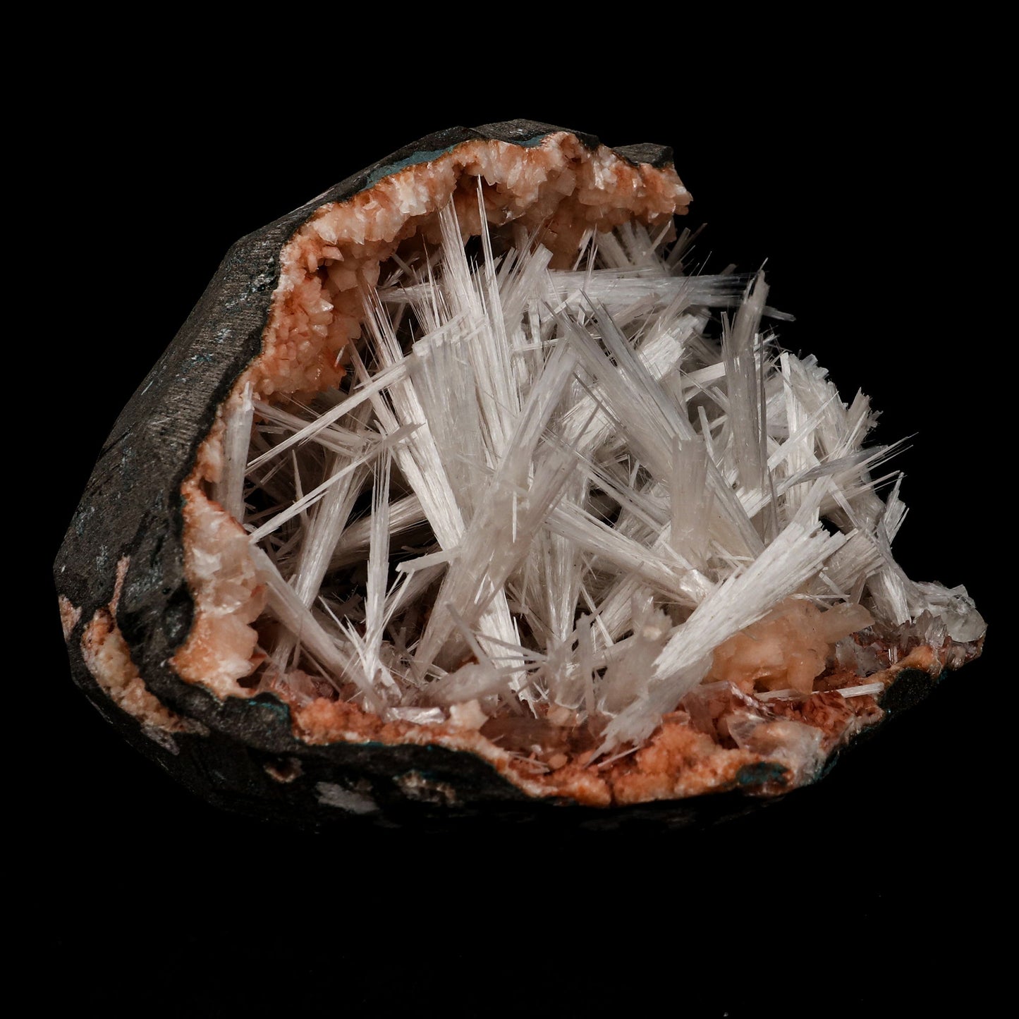 Scolecite Sprays Inside Heulandite Geode Natural Mineral Specimen # B…  https://www.superbminerals.us/products/scolecite-sprays-inside-heulandite-geode-natural-mineral-specimen-b-5304  Features: A geode with beige Heulandite crystals and a radial spray of glossy, colourless, ultra-transparent, needle-like Scolecite crystals, as well as numerous solitary crystals of Scolecite. It is nothing short of breathtaking - the crystal structure, luster, contrast, and symmetry are all perfect.