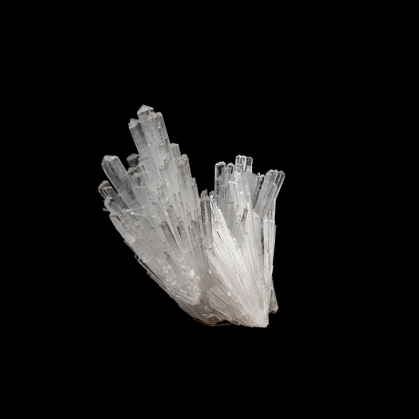 Scolecite Sprays Natural Mineral Specimen # B 5227  https://www.superbminerals.us/products/scolecite-sprays-natural-mineral-specimen-b-5227  Features: A huge, tapering spray of colourless elongated Scolecite crystals. A little fragment of matrix is linked to a small Stilbite crystal. Scolecite crystals have a glassy appearance and are highly translucent, with transparent terminations. A lovely specimen in superb condition. Primary Mineral(s): Scolecite