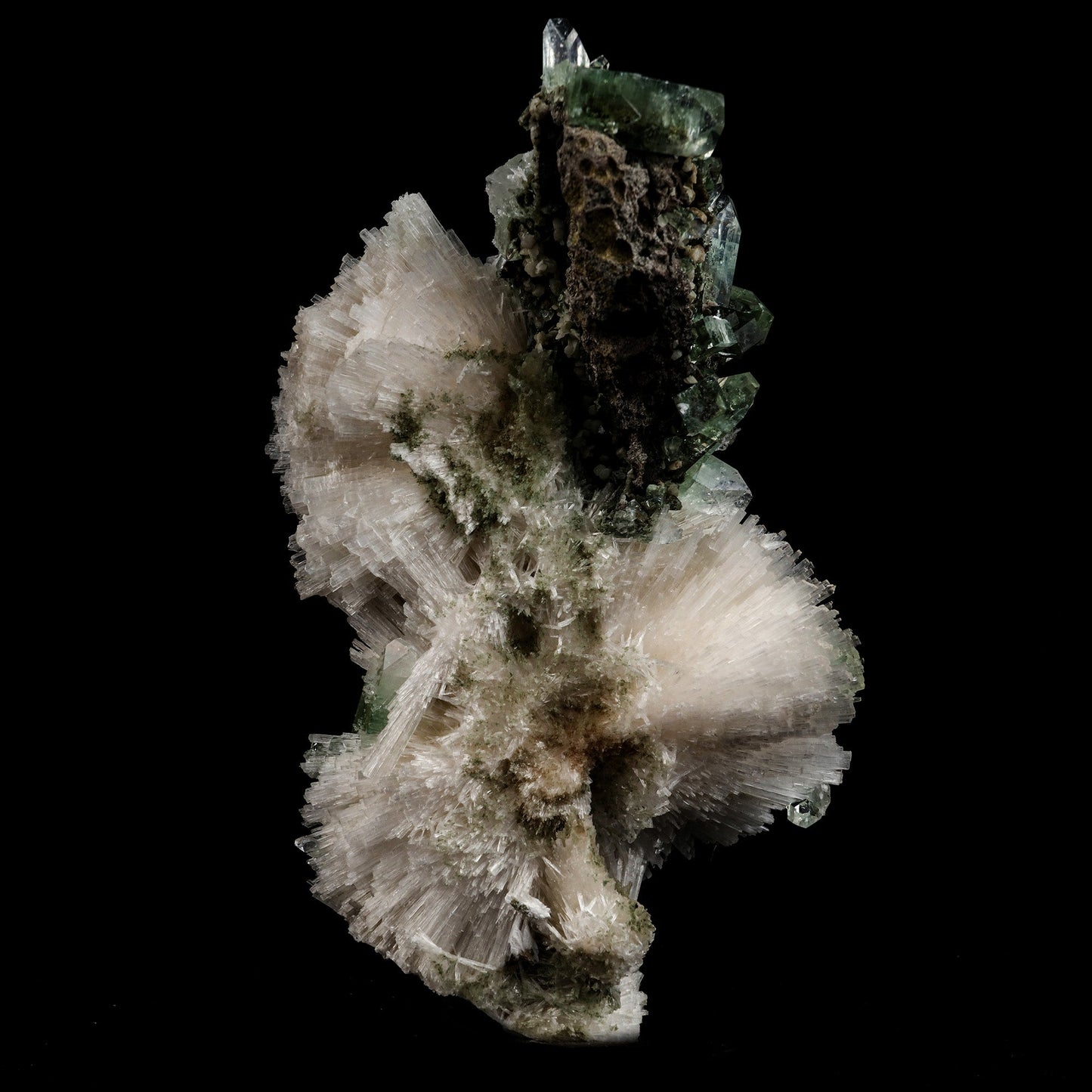 Scolecite Sprays with Green Apophyllite Natural Mineral Specimen # B …  https://www.superbminerals.us/products/scolecite-sprays-with-green-apophyllite-natural-mineral-specimen-b-5106  Features: Very rich porcupine quill spray of glassy scolecite needles is artistically set on the basalt matrix, which is covered with mint-green, frosted, Tetragonal Apophyllite crystals. Large combination material that is both outstanding and rare in today's market. Primary Mineral(s): Apophyllite