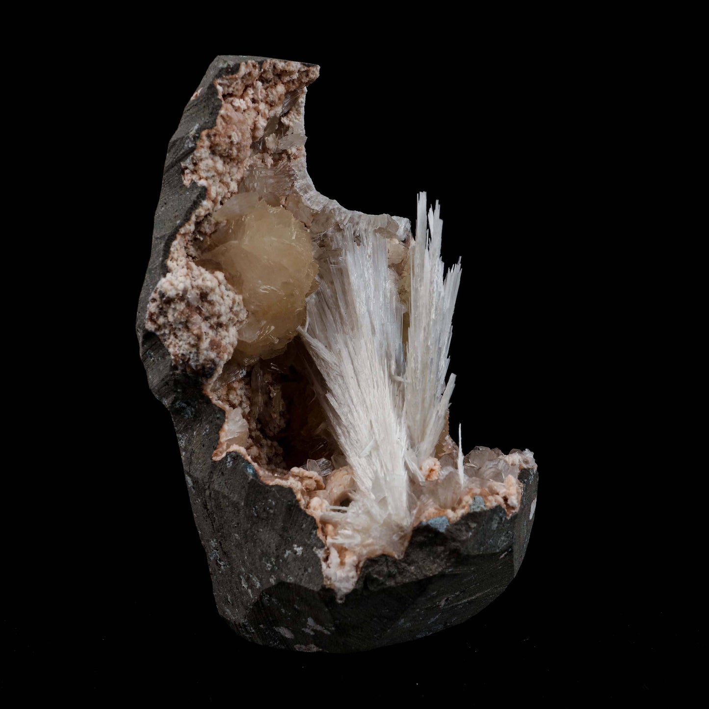 Scolecite Sprays with Stilbite Inside Heulandite Geode Natural Mineral…  https://www.superbminerals.us/products/scolecite-sprays-with-stilbite-inside-heulandite-geode-natural-mineral-specimen-b-4941  Features:A radial aggregation of scolecite in a narrow crystal-lined vug. The artwork was difficult to photograph, but it is even more striking in person. Because several of them are the FINEST crystallised examples of their own species anywhere on the planet, they will go down in history as the finest minerals