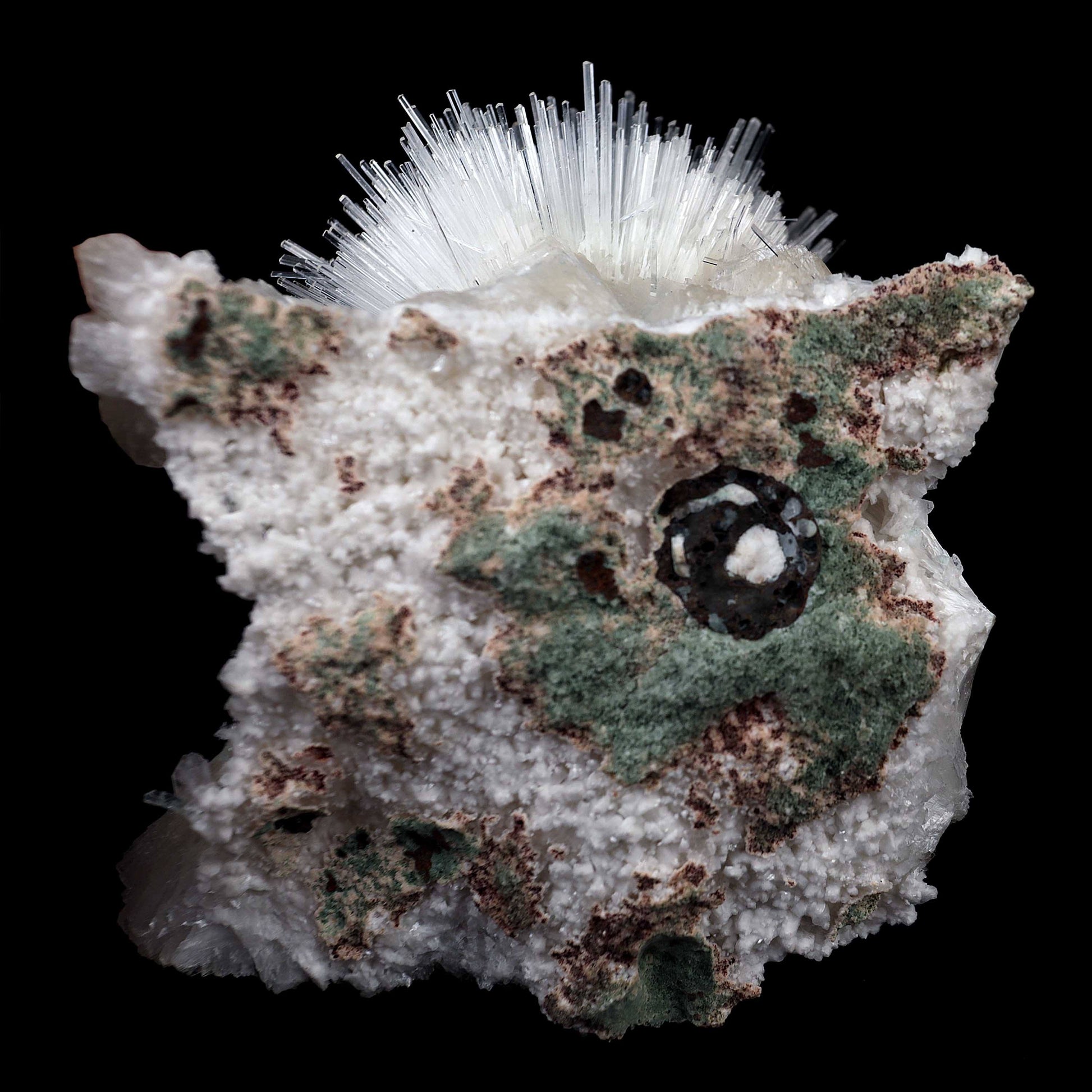 Scoleicte On Stilbite # B 4358  https://www.superbminerals.us/products/scoleicte-on-stilbite-b-4358  Features:A stunning specimen featuring a large, hemispherical formation of colorless, transparent, lustrous acicular Scolecite crystals on peach-colored Stilbite. An amazing piece with superb crystal formation, contrast, luster and contrast. In excellent condition. A great addition to any collection.
