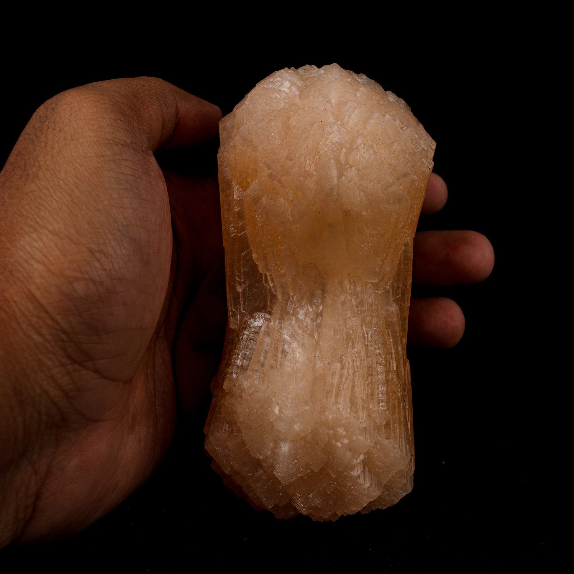 Stilbite Bow Shape Natural Mineral Specimen # B 5097  https://www.superbminerals.us/products/stilbite-bow-shape-natural-mineral-specimen-b-5097  Features: The best viewing angle for this specimen shows a 3-dimensional upright stilbite "bow tie," with a pastel salmon color and great luster and translucence. The matrix is a thin veneer of Heulandite. Primary Mineral(s): Stilbite Secondary Mineral(s): N/AMatrix: N/A 5 Inch x 2 InchWeight : 432