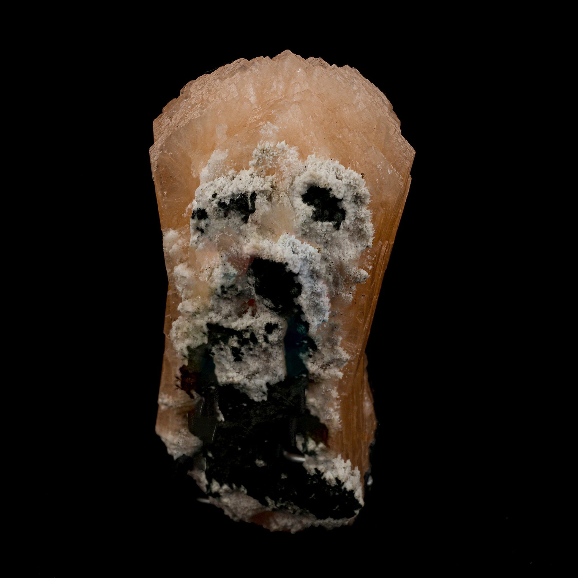 Stilbite Bow Shape Natural Mineral Specimen # B 5097  https://www.superbminerals.us/products/stilbite-bow-shape-natural-mineral-specimen-b-5097  Features: The best viewing angle for this specimen shows a 3-dimensional upright stilbite "bow tie," with a pastel salmon color and great luster and translucence. The matrix is a thin veneer of Heulandite. Primary Mineral(s): Stilbite Secondary Mineral(s): N/AMatrix: N/A 5 Inch x 2 InchWeight : 432
