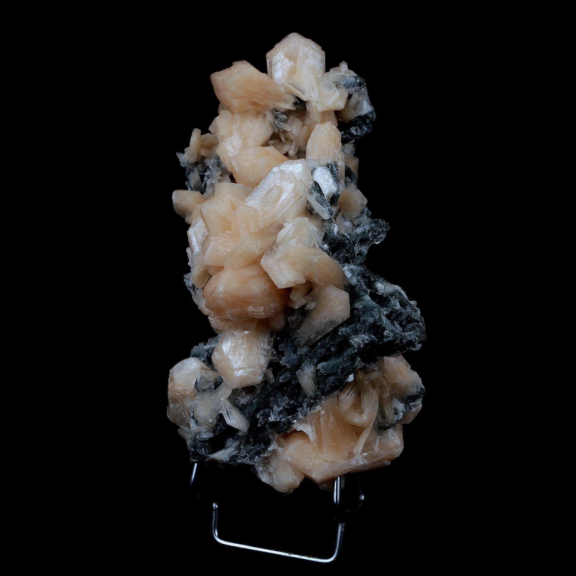 Stilbite Crystals on Chalcedony Big Cluster Natural Mineral Specimen #…  https://www.superbminerals.us/products/stilbite-crystals-on-chalcedony-big-cluster-natural-mineral-specimen-b-3996  Features A large sized pink tinged transparent chalcedony standing on top of a open vug like specimen with rich salmon colored Stilbites and other smaller sized pink Stilbite. The vug is very aesthetically cut and is high in luster and beauty. Primary Mineral(s):&nbsp; Stilbite