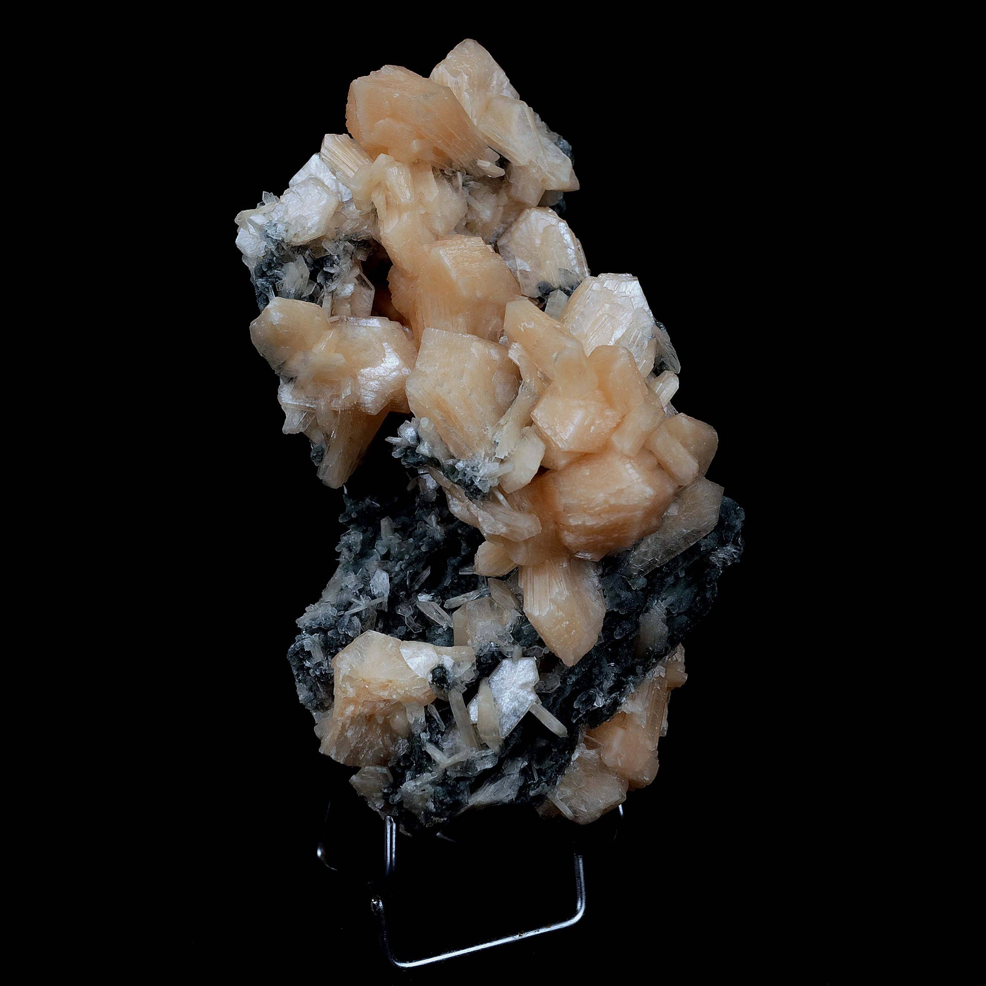 Stilbite Crystals on Chalcedony Big Cluster Natural Mineral Specimen #…  https://www.superbminerals.us/products/stilbite-crystals-on-chalcedony-big-cluster-natural-mineral-specimen-b-3996  Features A large sized pink tinged transparent chalcedony standing on top of a open vug like specimen with rich salmon colored Stilbites and other smaller sized pink Stilbite. The vug is very aesthetically cut and is high in luster and beauty. Primary Mineral(s):&nbsp; Stilbite