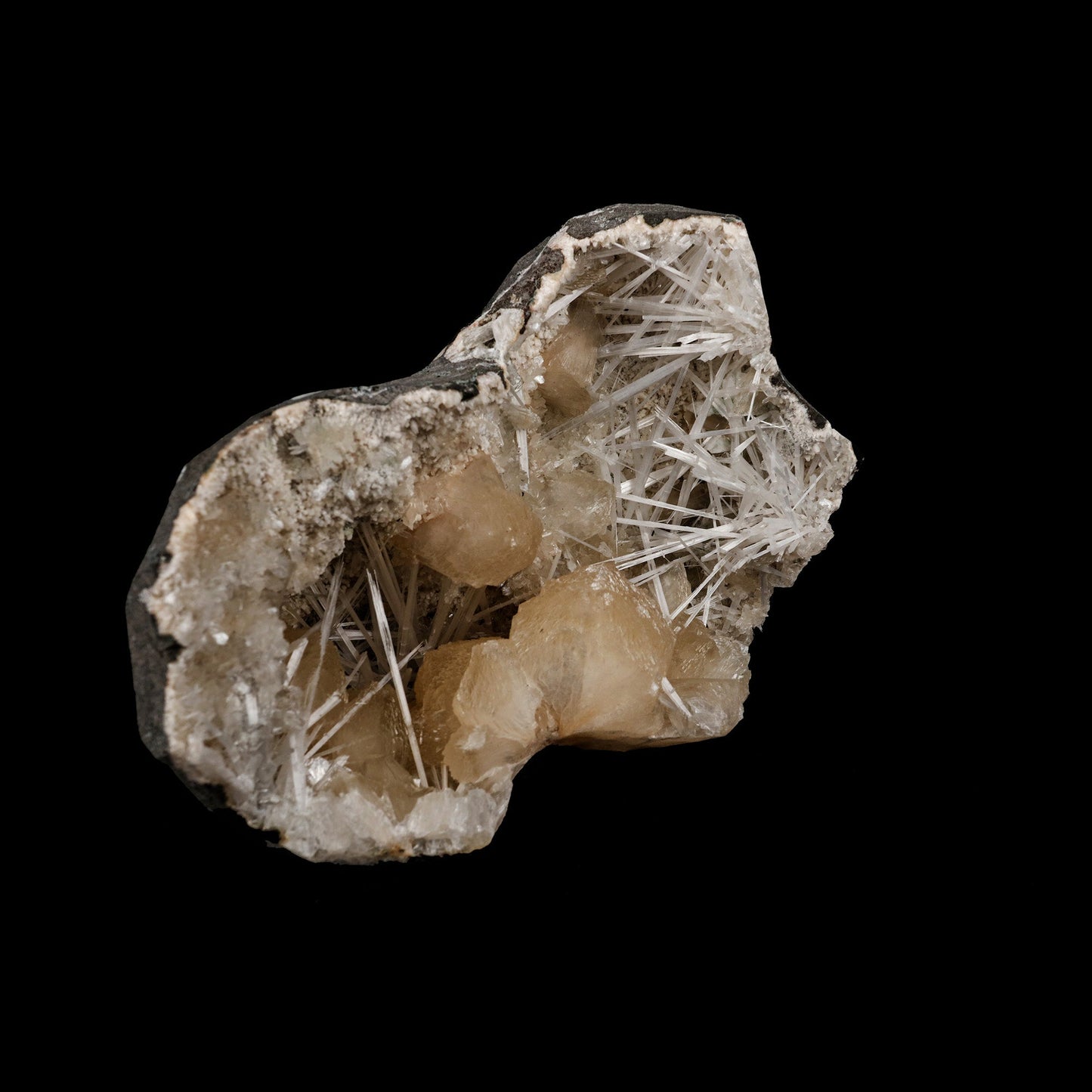 Stilbite Crystals with Scolecite on Heulandite Natural Mineral Specime…  https://www.superbminerals.us/products/stilbite-crystals-with-scolecite-on-heulandite-natural-mineral-specimen-b-5262  Features: Throughout a large geode, Scholecite crystals are interspersed with beige Heulandite crystals. Scolecite crystal sprays are glossy, colourless, highly translucent, and needle-like in shape. Each crystal creation is like a work of art itself. Primary Mineral(s): Stilbite Secondary Mineral(s): Scolecite