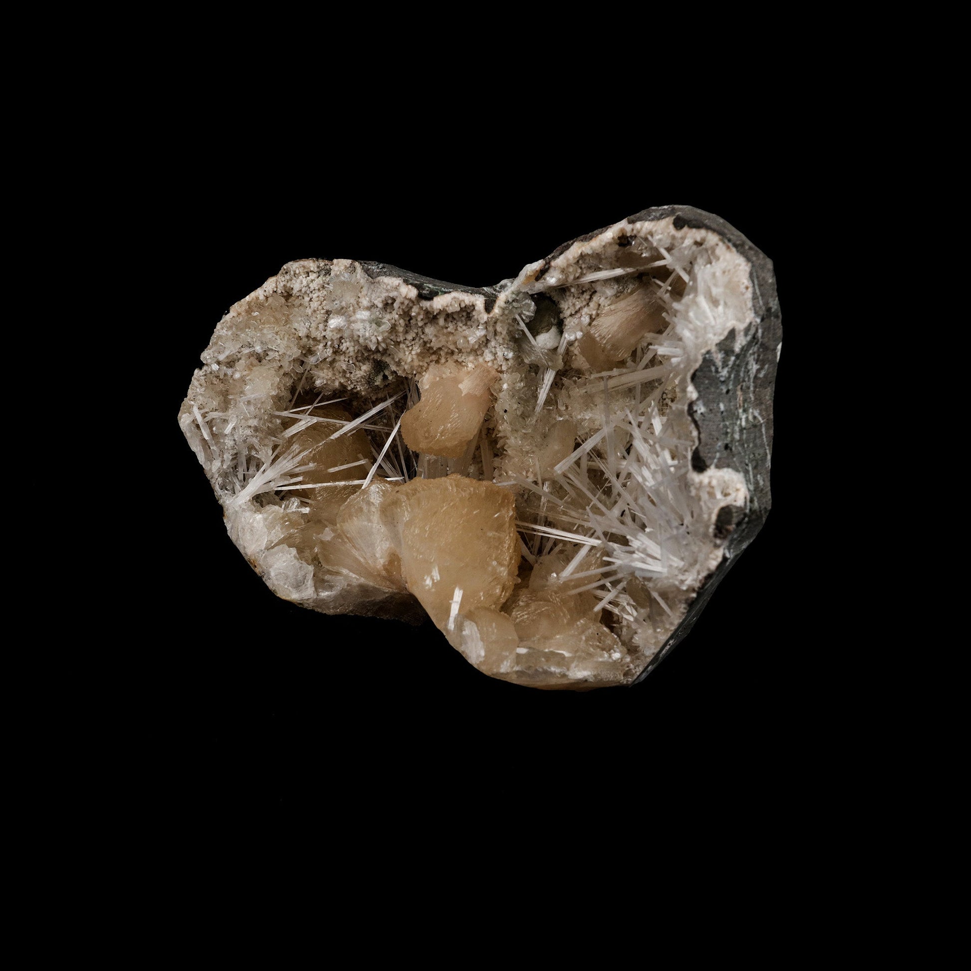 Stilbite Crystals with Scolecite on Heulandite Natural Mineral Specime…  https://www.superbminerals.us/products/stilbite-crystals-with-scolecite-on-heulandite-natural-mineral-specimen-b-5262  Features: Throughout a large geode, Scholecite crystals are interspersed with beige Heulandite crystals. Scolecite crystal sprays are glossy, colourless, highly translucent, and needle-like in shape. Each crystal creation is like a work of art itself. Primary Mineral(s): Stilbite Secondary Mineral(s): Scolecite