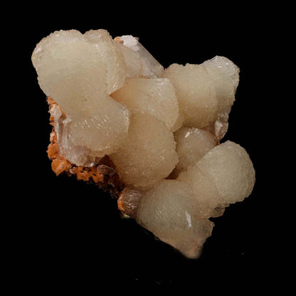 Stilbite Lusterous Cluster Natural Mineral Specimen # B 5185  https://www.superbminerals.us/products/stilbite-lusterous-cluster-natural-mineral-specimen-b-5185  Features: Featuring many excellent quality bladed groups of Stilbite in a soft white hue, resting over pearly stalactitic formations of peach colored Heulandite, this piece is a stunning example of the material. The sculpture is really flashy and three-dimensional, and I particularly like how the Stilbites 