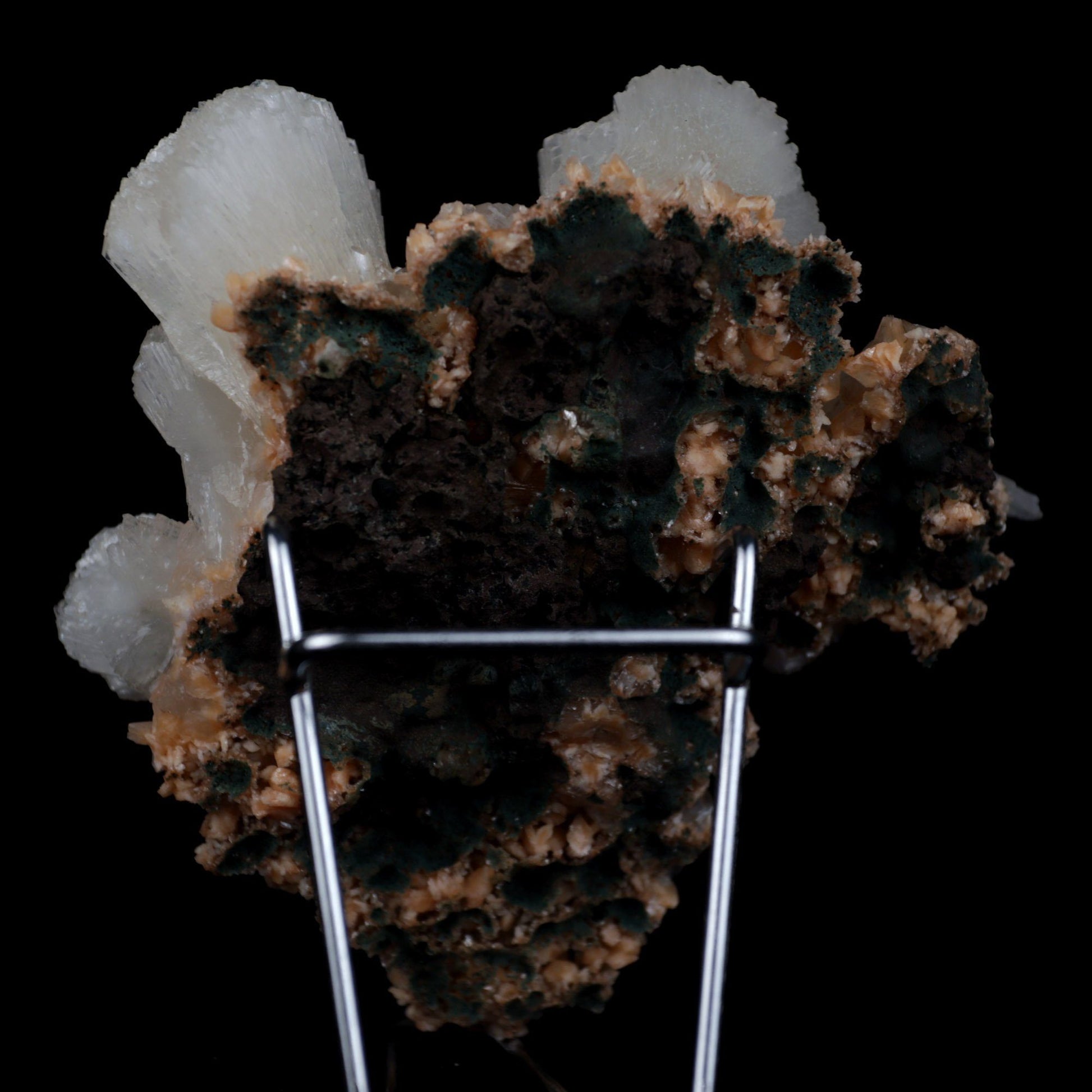 Stilbite Lusterous on Heulandite Natural Mineral Specimen # B 4917  https://www.superbminerals.us/products/stilbite-lusterous-on-heulandite-natural-mineral-specimen-b-4917  Features: A magnificent doubly terminated stilbite bowtie with outstanding wide shape is placed artistically on the blocky basalt matrix.&nbsp; The many glossy bone-white bladed heulandites scattered over the matrix beautifully compliment the very lustrous, transparent, cream-colored stilbite.