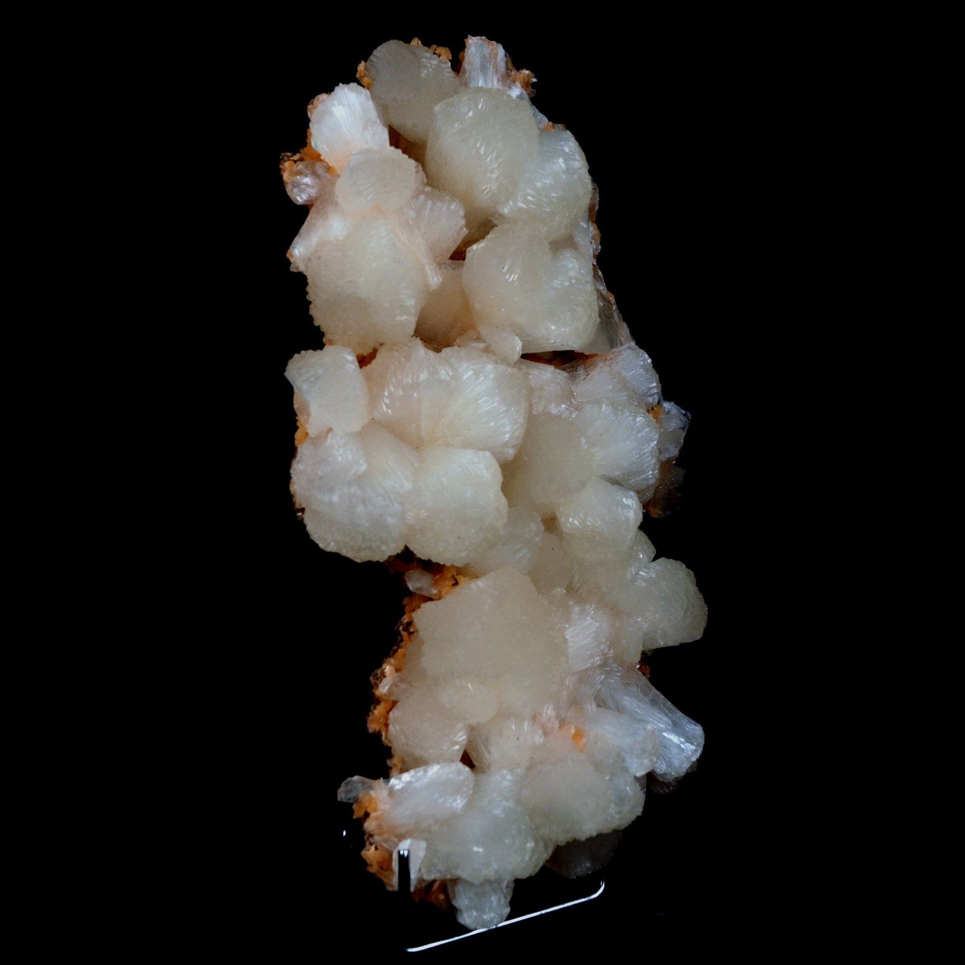 Stilbite on Heulandite Natural Mineral Specimen # B 4729  https://www.superbminerals.us/products/stilbite-on-heulandite-natural-mineral-specimen-b-4729  Features: Featuring many excellent quality bladed groups of Stilbite in a soft white hue, resting over pearly stalactitic formations of peach colored Heulandite, this piece is a stunning example of the material. The sculpture is really flashy and three-dimensional, and I particularly like how the Stilbites