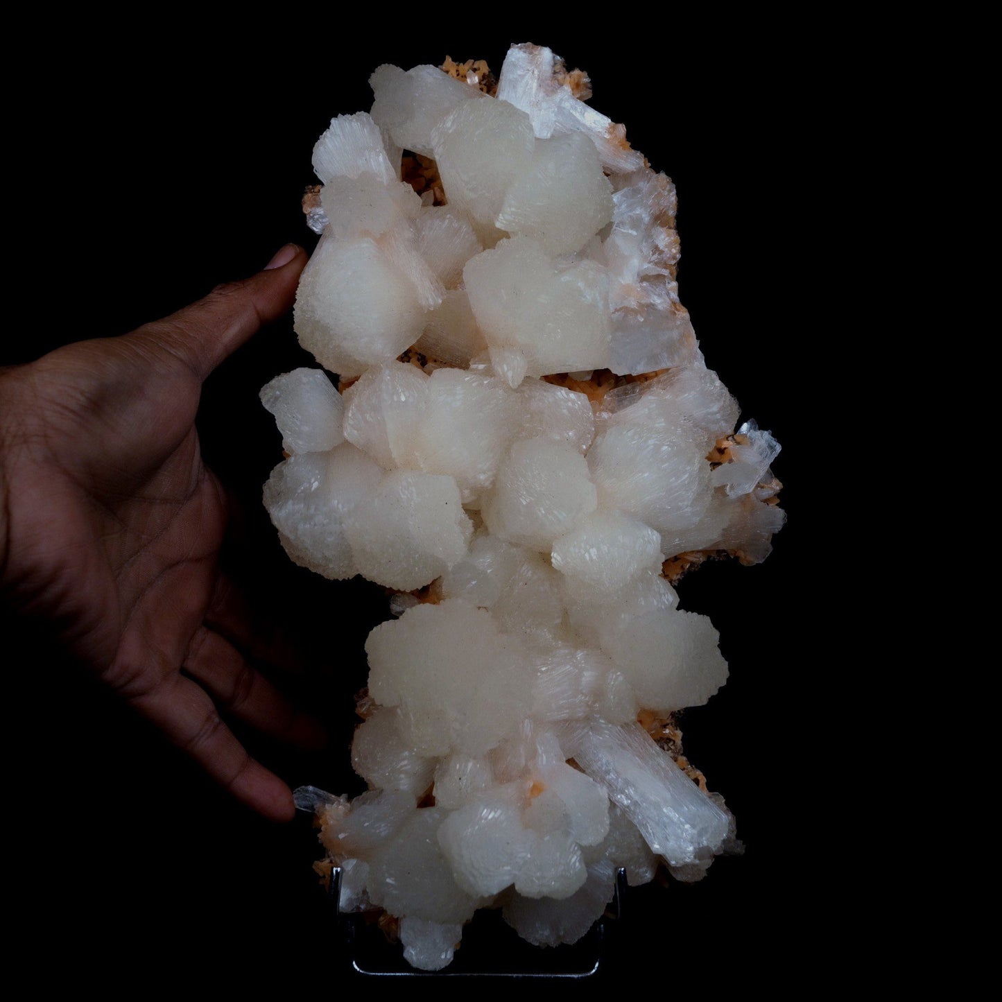 Stilbite on Heulandite Natural Mineral Specimen # B 4729  https://www.superbminerals.us/products/stilbite-on-heulandite-natural-mineral-specimen-b-4729  Features: Featuring many excellent quality bladed groups of Stilbite in a soft white hue, resting over pearly stalactitic formations of peach colored Heulandite, this piece is a stunning example of the material. The sculpture is really flashy and three-dimensional, and I particularly like how the Stilbites