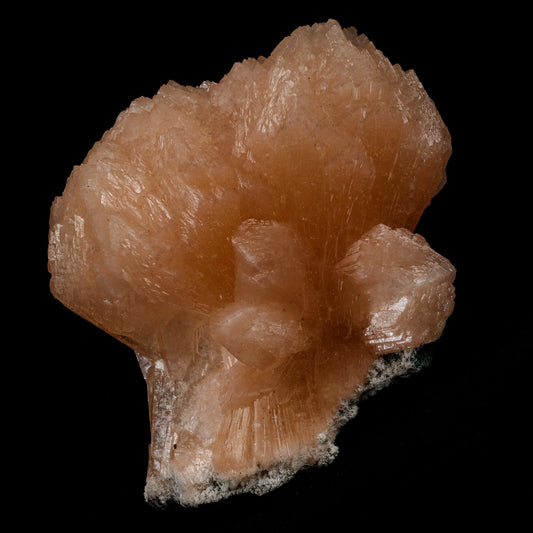 Stilbite Twin Terminated Natural Mineral Specimen # B 5153  https://www.superbminerals.us/products/stilbite-twin-terminated-natural-mineral-specimen-b-5153  Features: This stilbite "bow tie" is beautiful, glossy, translucent, salmon pink.The shape and colour are stunning! As a species, it's quite common, and in classic bowtie shape, it's quite typical; a one-of-a-kind specimen for display purposes. Primary Mineral(s): Stilbite Secondary Mineral(s): N/AMatrix: Chalcedony