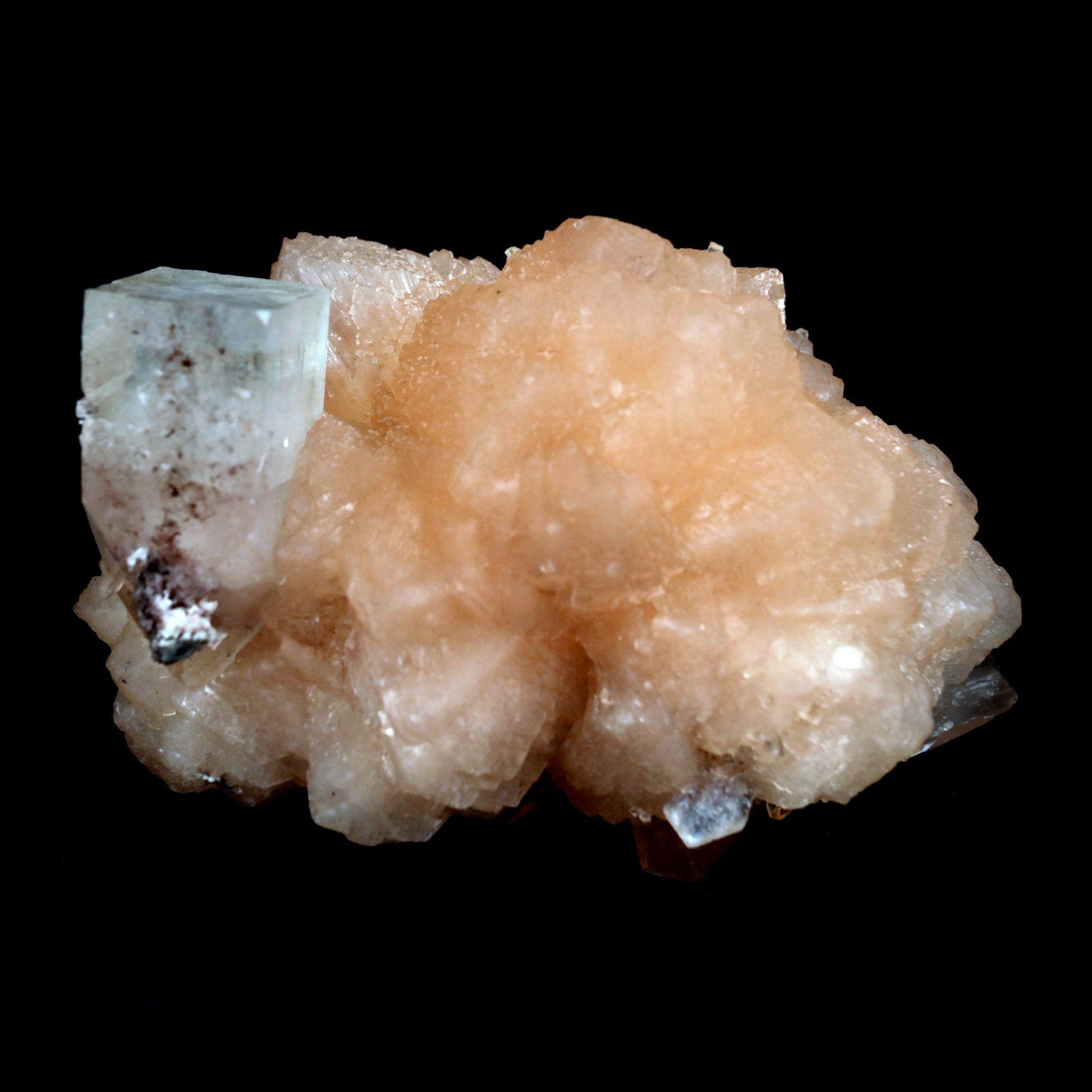 Stilbite with Apophyllite on Chalcedony Natural Mineral Specimen # B …  https://www.superbminerals.us/products/stilbite-with-apophyllite-on-chalcedony-natural-mineral-specimen-b-4800  Features: An impressive doubly terminated, lustrous salmon-pink bladed stilbite bowtie, nicely accented with side car crystals, is dramatically set on the thin basalt crust on this beautifully sculptural small cabinet from recent finds in Jalgaon. The secondary doubly terminated stilbite. Small stilbite and smaller