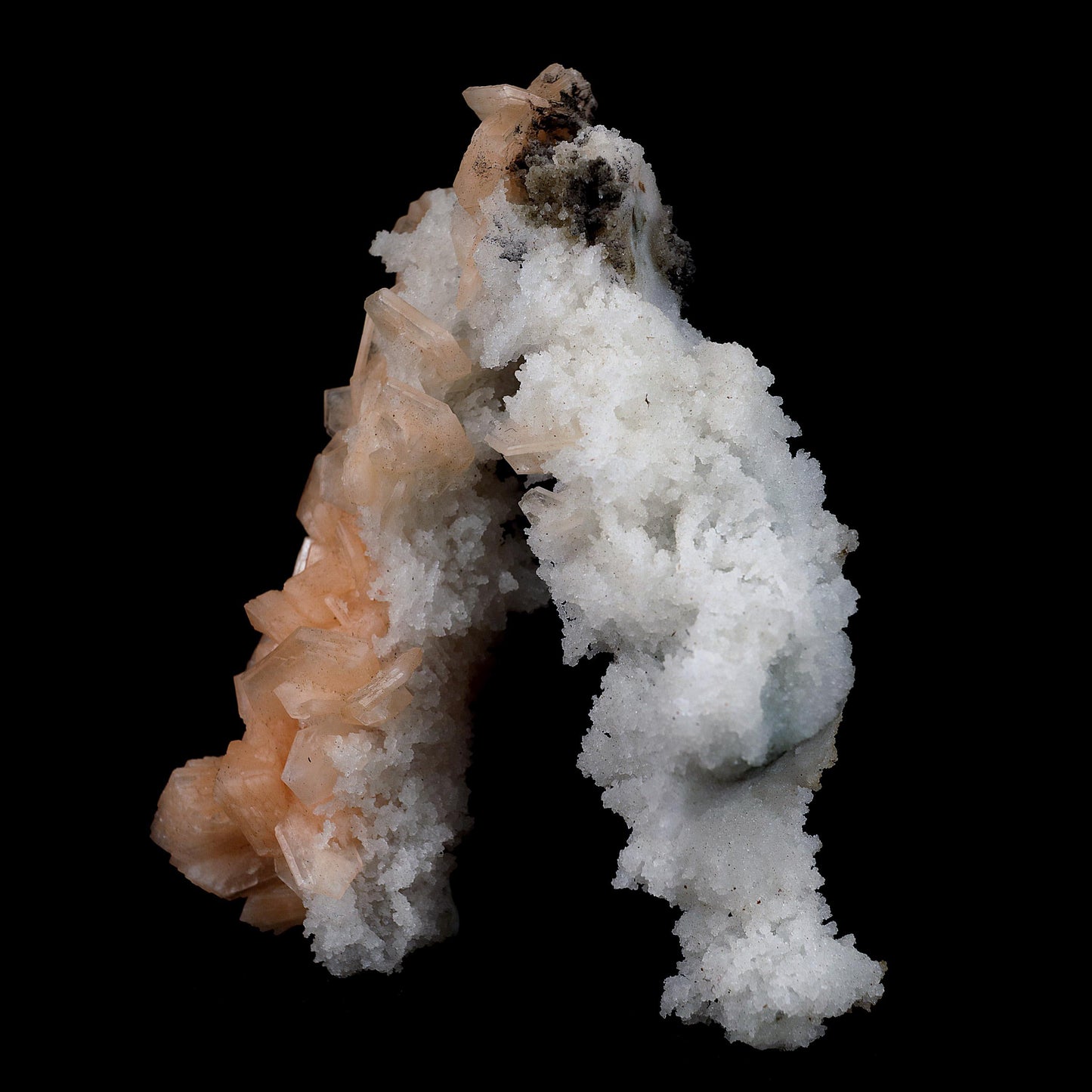 Stilbite with Chalcedony 'V' Formation Natural Mineral Specimen # B 39…  https://www.superbminerals.us/products/stilbite-with-chalcedony-v-formation-natural-mineral-specimen-b-3973  Features This intricate Chalcedony stalactite hosts red-peach Stilbite and beautifully smaller gemmy Stilbite crystal on a another part of Chalcedony contrasting matrix.&nbsp; Endless fractal adventures await! Primary Mineral(s):&nbsp; Stilbite Secondary Mineral(s): N/AMatrix: Chalcedony14 cm x 10 cm345 Gms