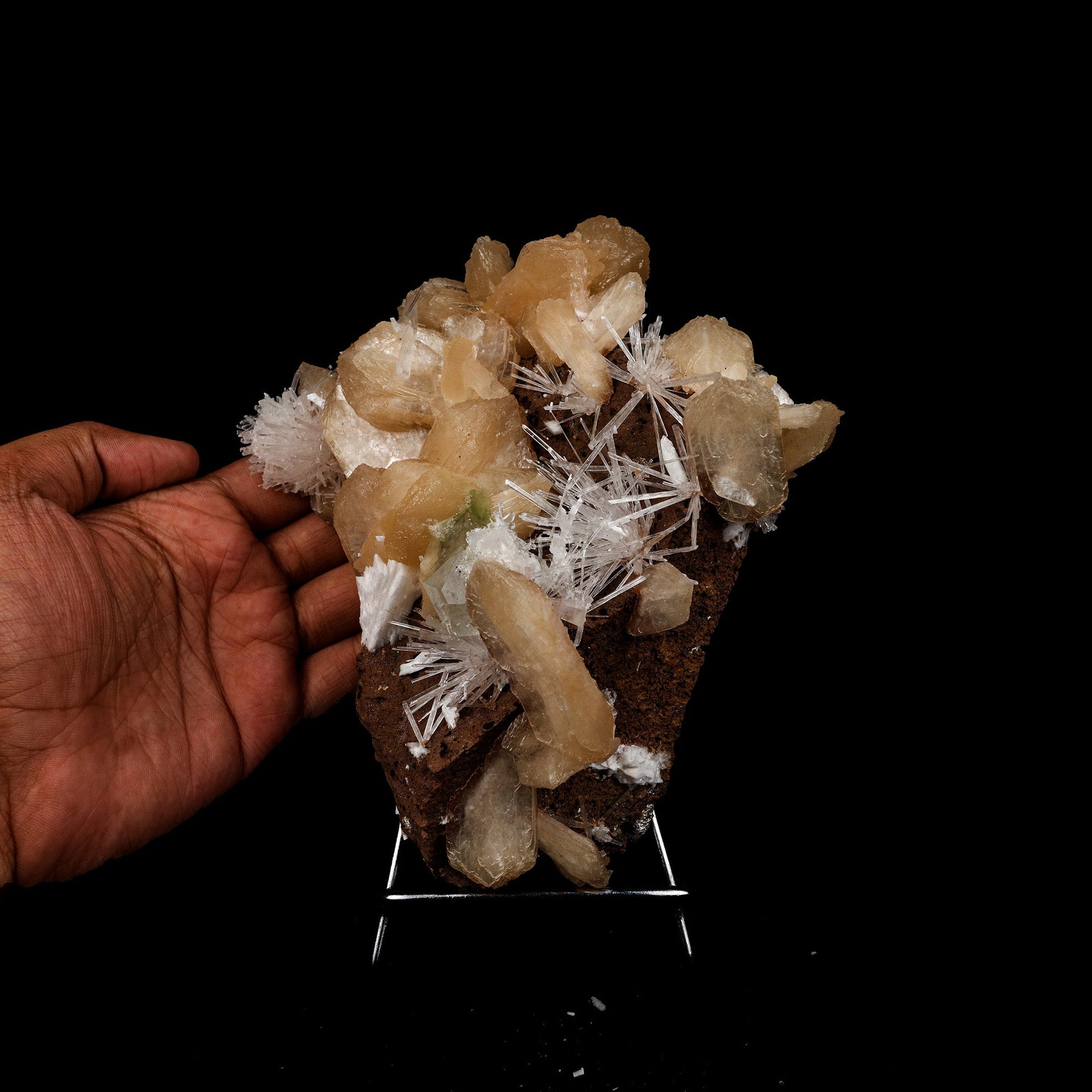 Stilbite with Scolecite Sprays Natural Mineral Specimen # B 5274  https://www.superbminerals.us/products/stilbite-with-scolecite-sprays-natural-mineral-specimen-b-5274  Features: This specimen features a large, radial formation of colorless, transparent, lustrous acicular Scolecite crystals on peach-colored Stilbite. Primary Mineral(s): Scolecite Secondary Mineral(s): StilbiteMatrix: N/A 7 Inch x 6 InchWeight : 955 GmsLocality: Jalgaon, Maharashtra, India Year of Discovery: 2021