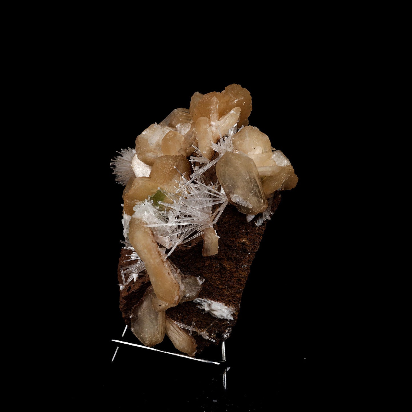Stilbite with Scolecite Sprays Natural Mineral Specimen # B 5274  https://www.superbminerals.us/products/stilbite-with-scolecite-sprays-natural-mineral-specimen-b-5274  Features: This specimen features a large, radial formation of colorless, transparent, lustrous acicular Scolecite crystals on peach-colored Stilbite. Primary Mineral(s): Scolecite Secondary Mineral(s): StilbiteMatrix: N/A 7 Inch x 6 InchWeight : 955 GmsLocality: Jalgaon, Maharashtra, India Year of Discovery: 2021